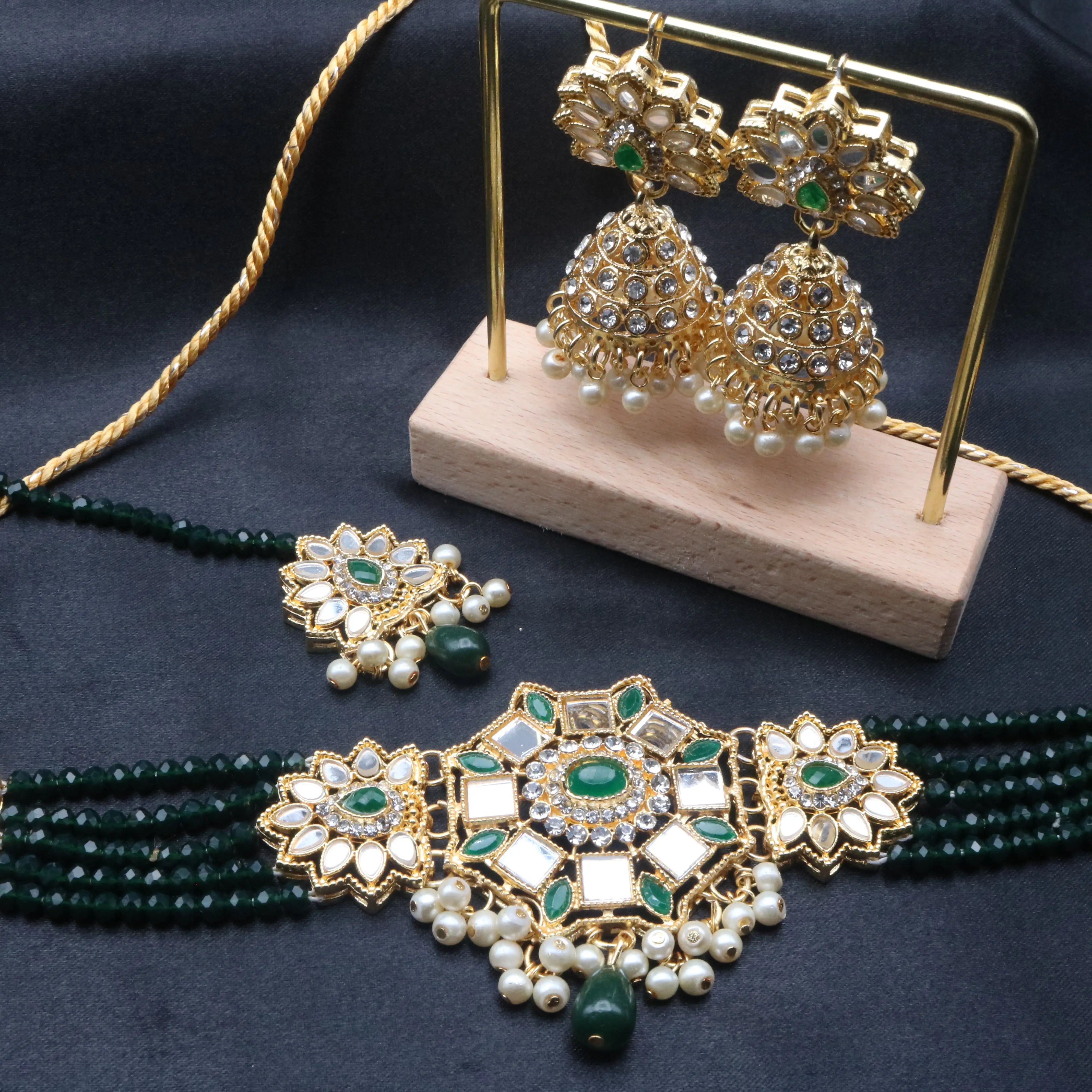 Full view of Zinnia green kundan jewelry set featuring beaded choker and jhumka earrings
