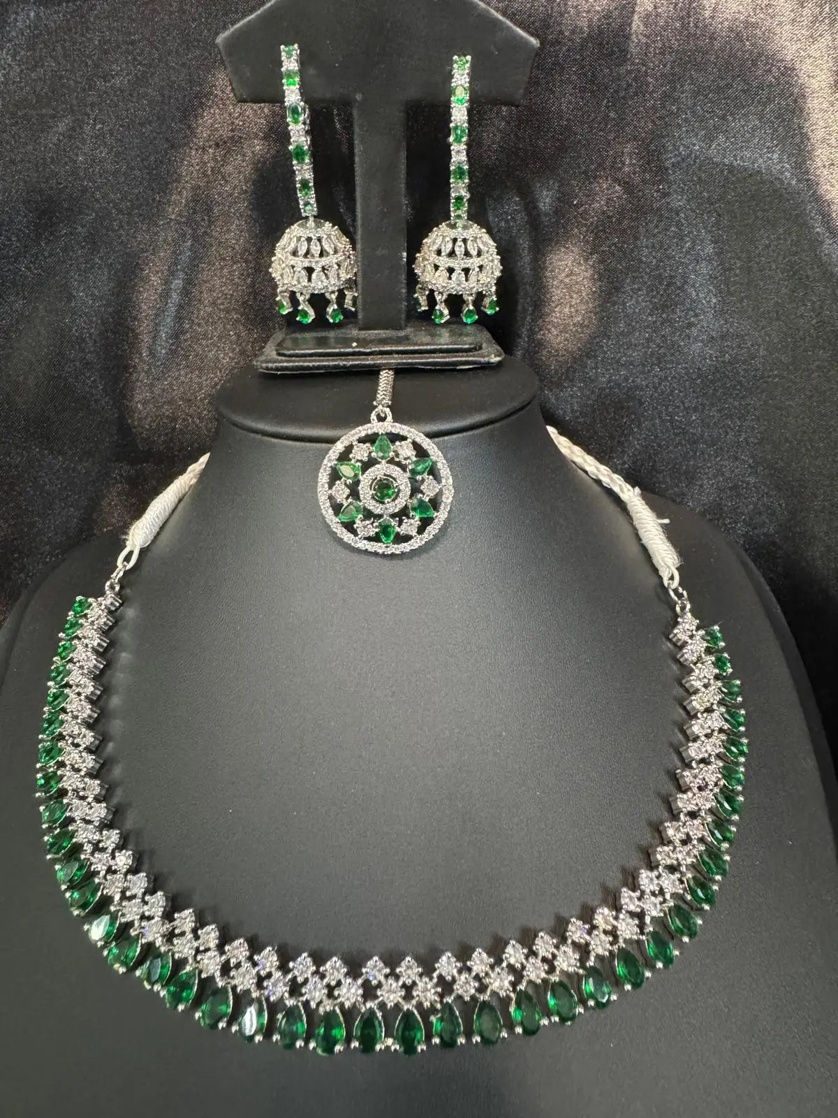 Full Ameerah necklace set including jhumka earrings and matching green pendant, displayed elegantly on black background.