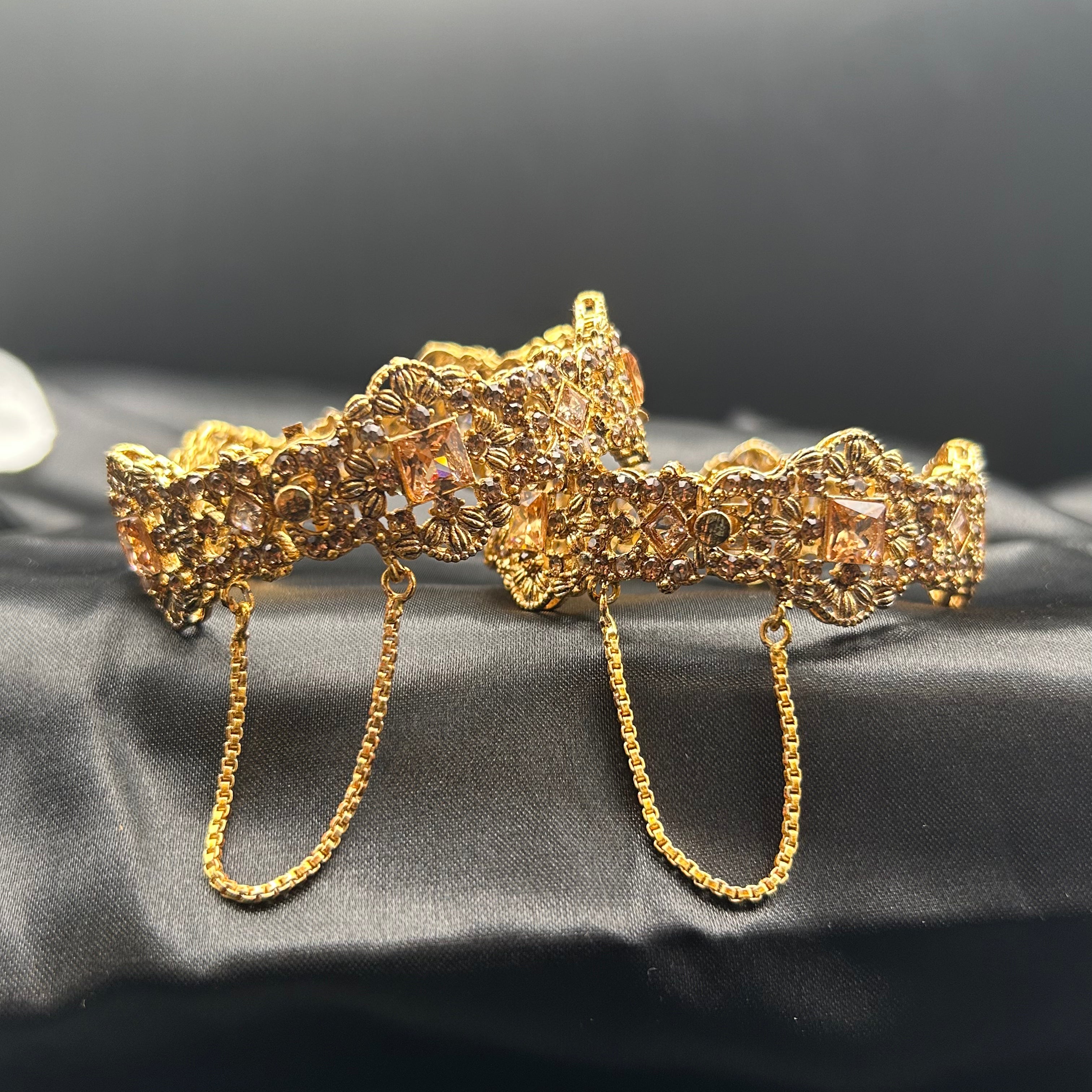 Flat view of Ancient bangles with champagne stones and gold detailing
