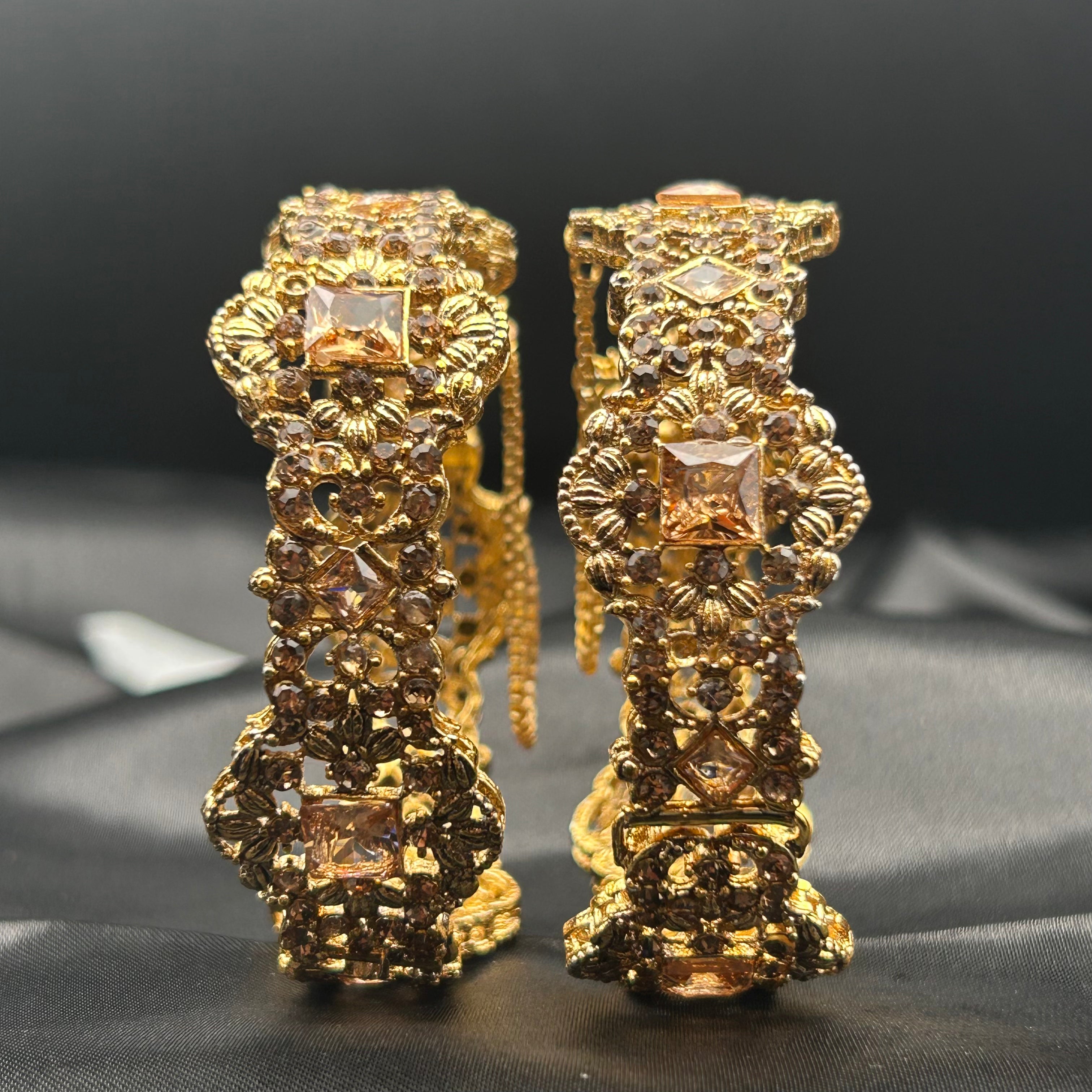 upright view showing full design and chain clasp on Ancient bangles