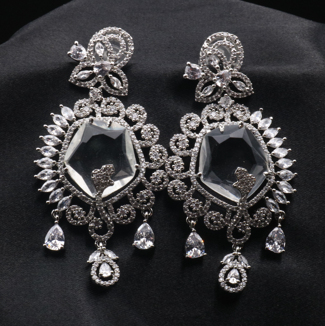 pair of silver American diamond earrings with clear gemstones. Stainless steel and waterproof.