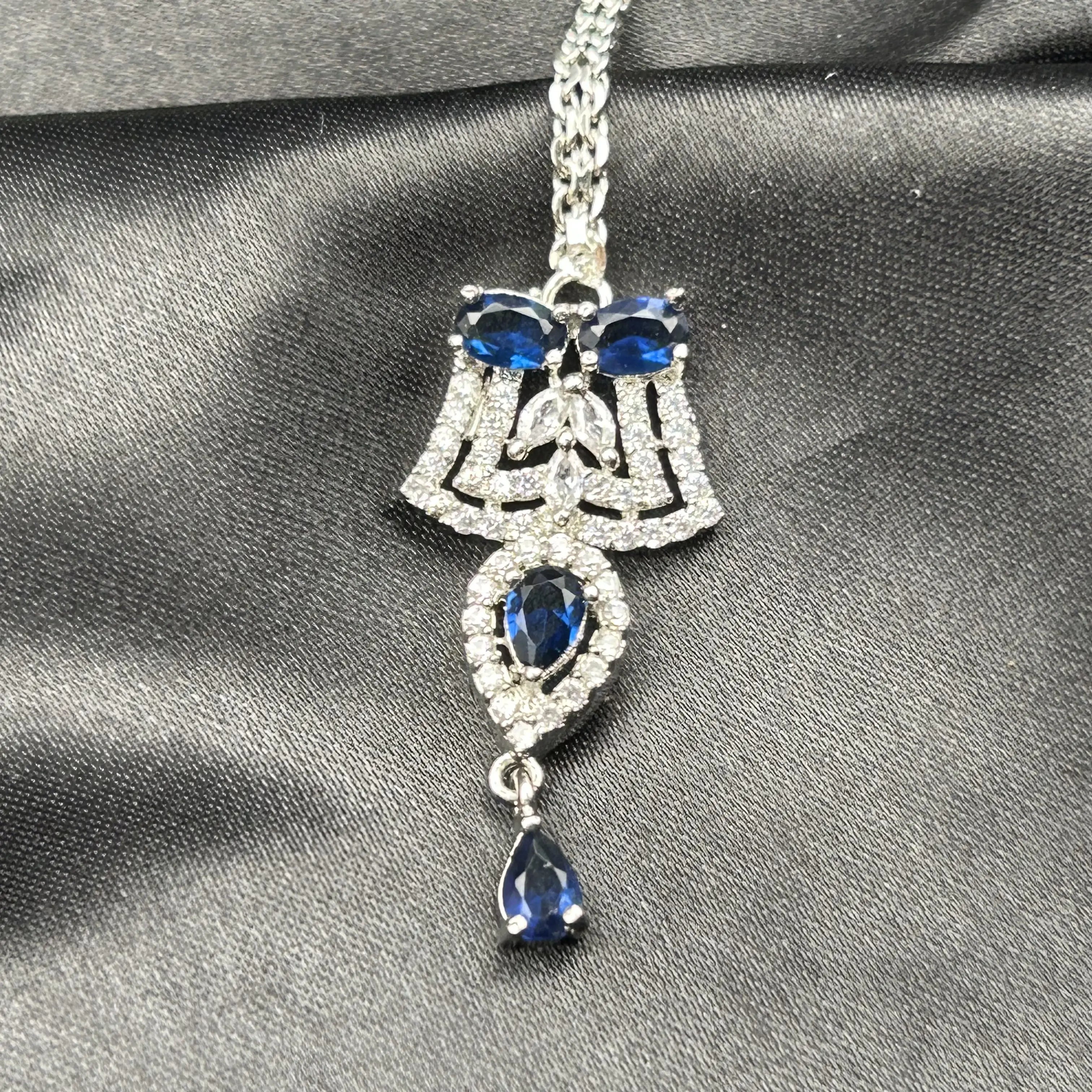 Aster Teeka with sapphire blue stones and American diamonds