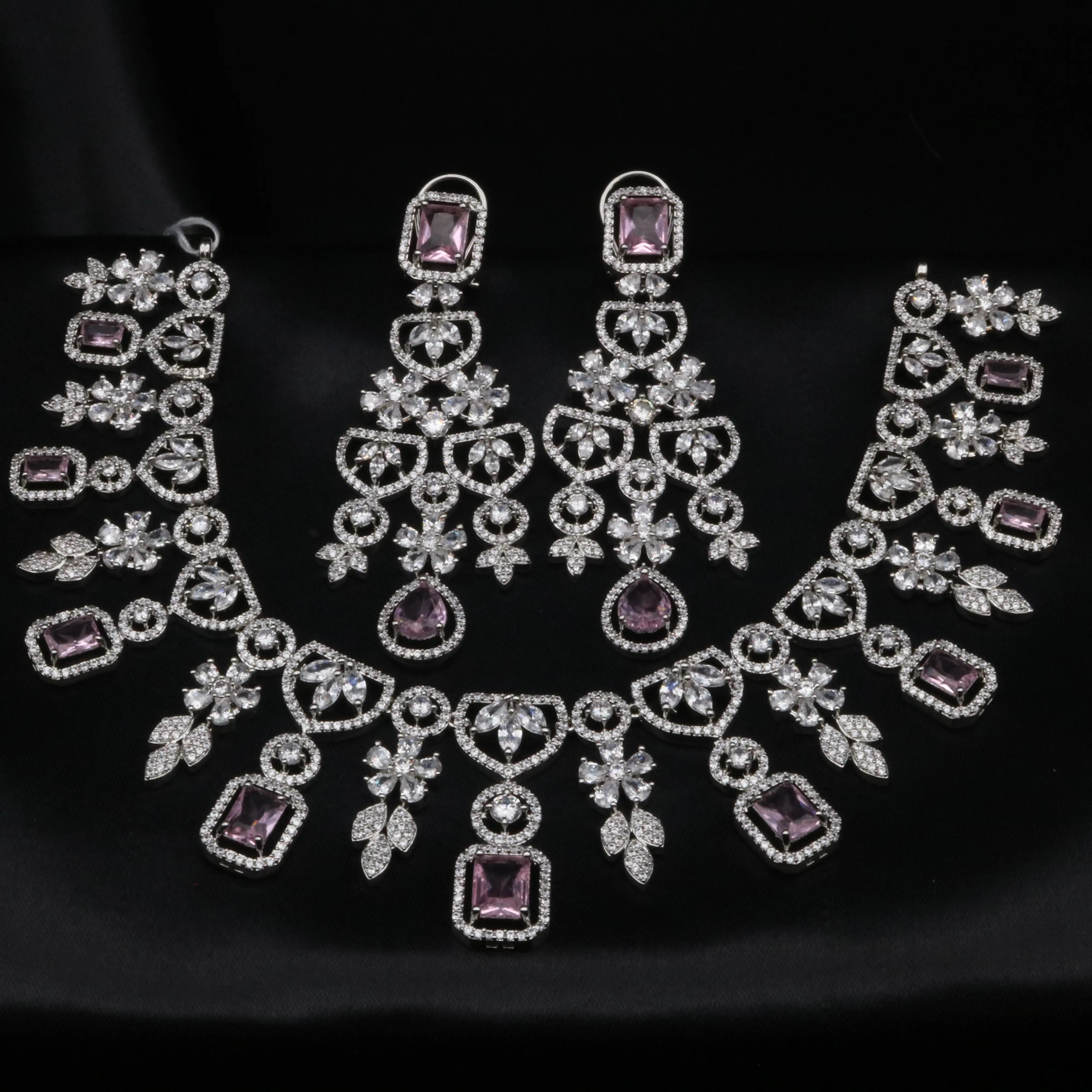 Full bridal necklace set with lavender square and teardrop CZ stones arranged in floral silver-tone settings.