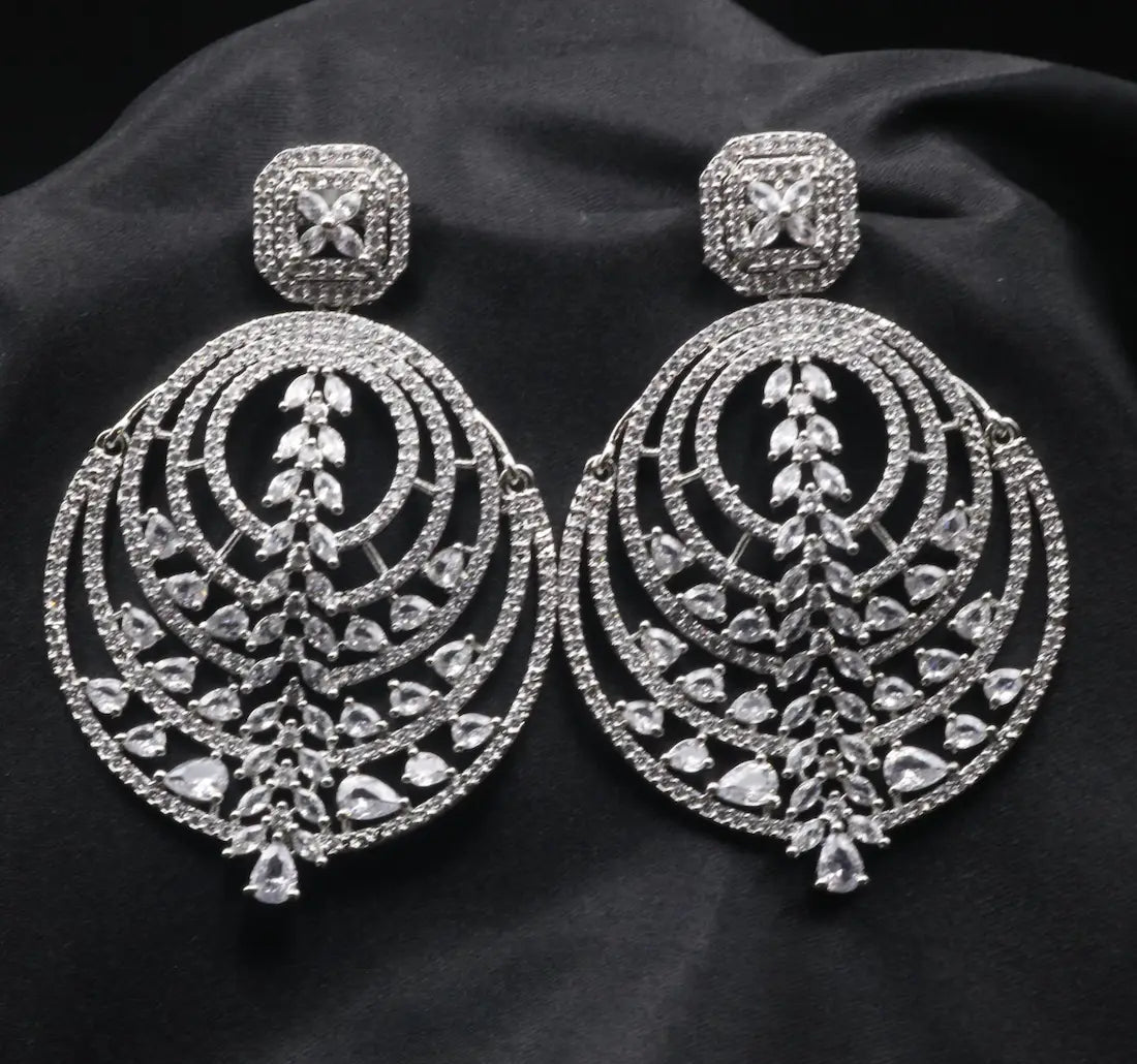 American diamonds earrings with clear gemstones on a black background