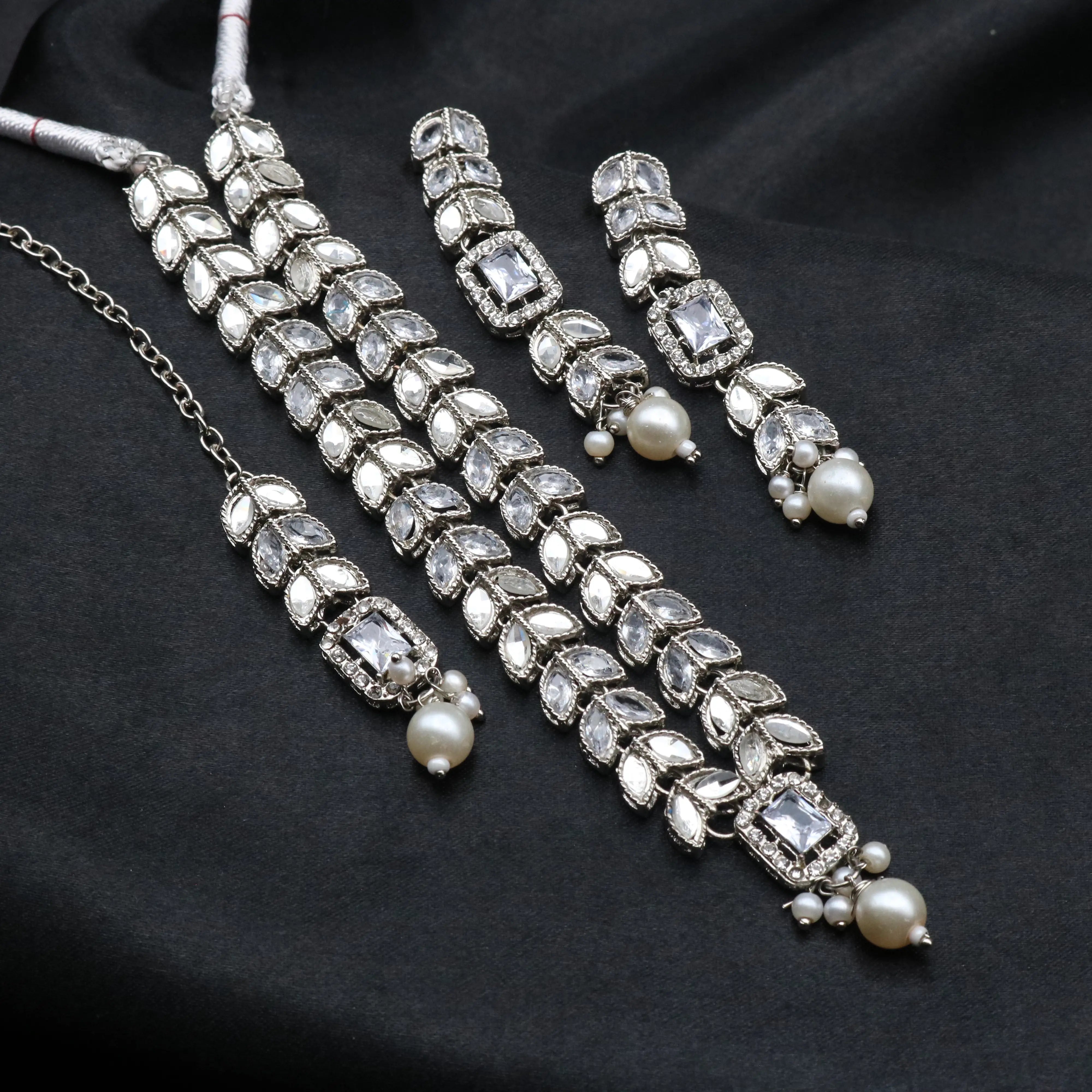 Bloom set in classic white featuring crystal-clear CZ stones and silver polish.