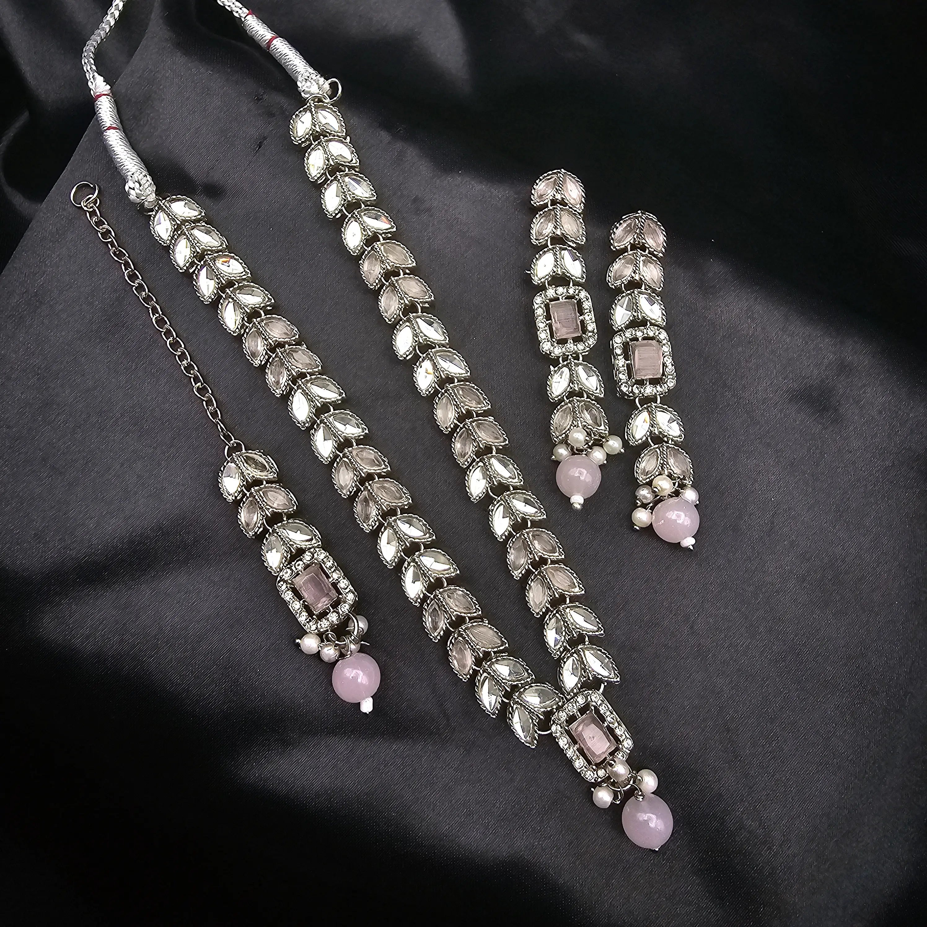 Bloom necklace in blush pink variant with soft pink CZ stones on silver finish.