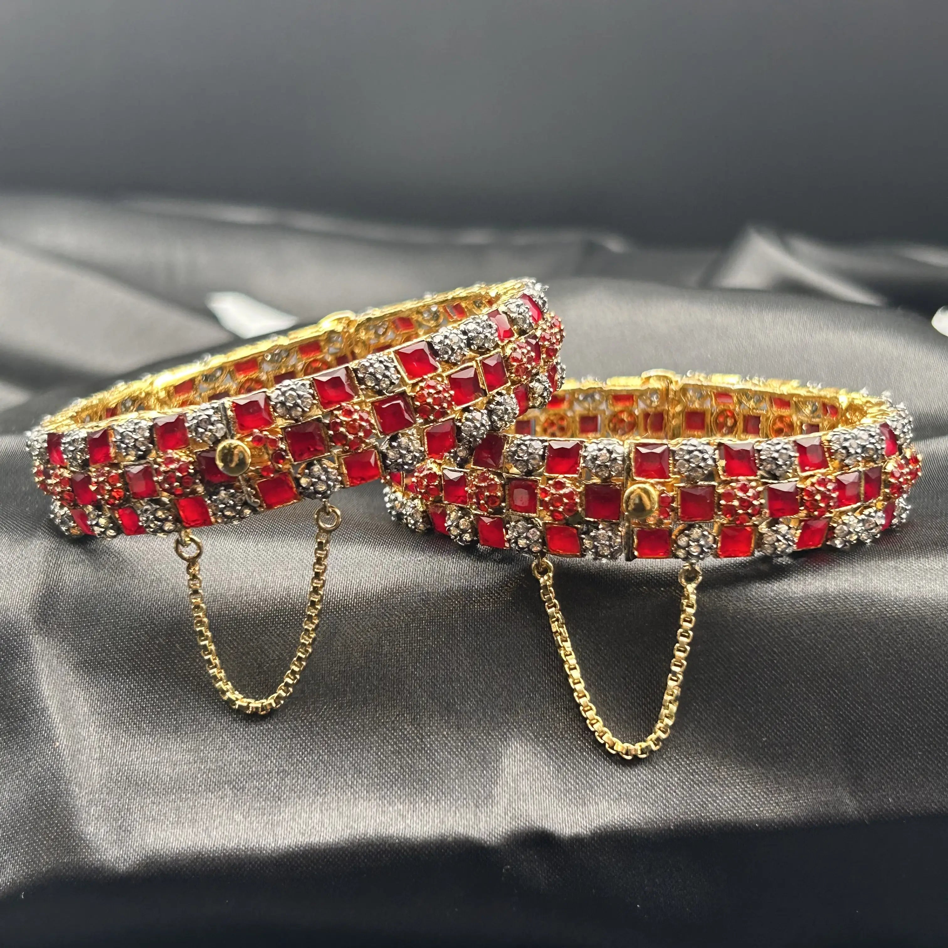 Braided Bangles with ruby red stones and diamond accents – front angle