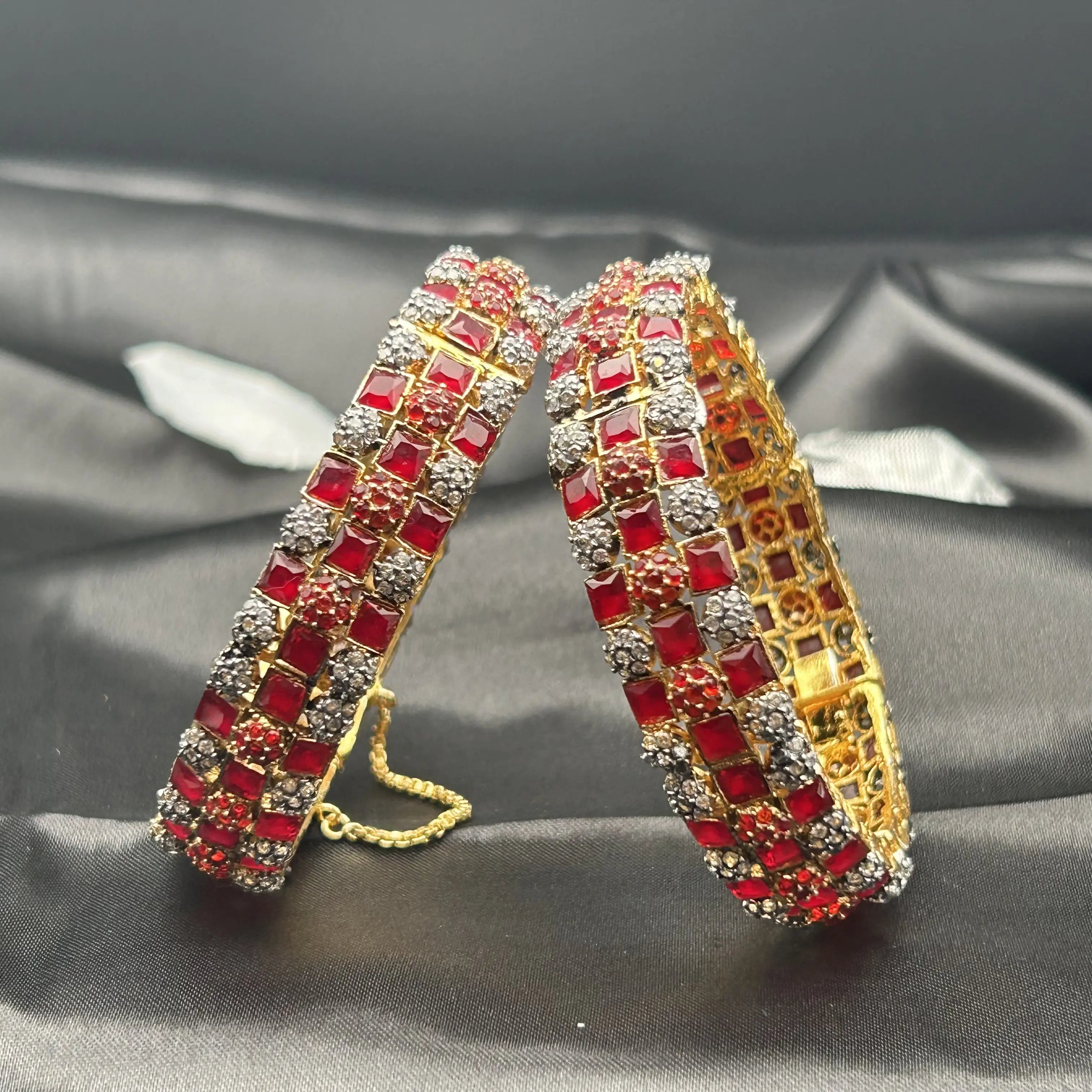 Gold braided bangles with red square stones and crystals – close-up