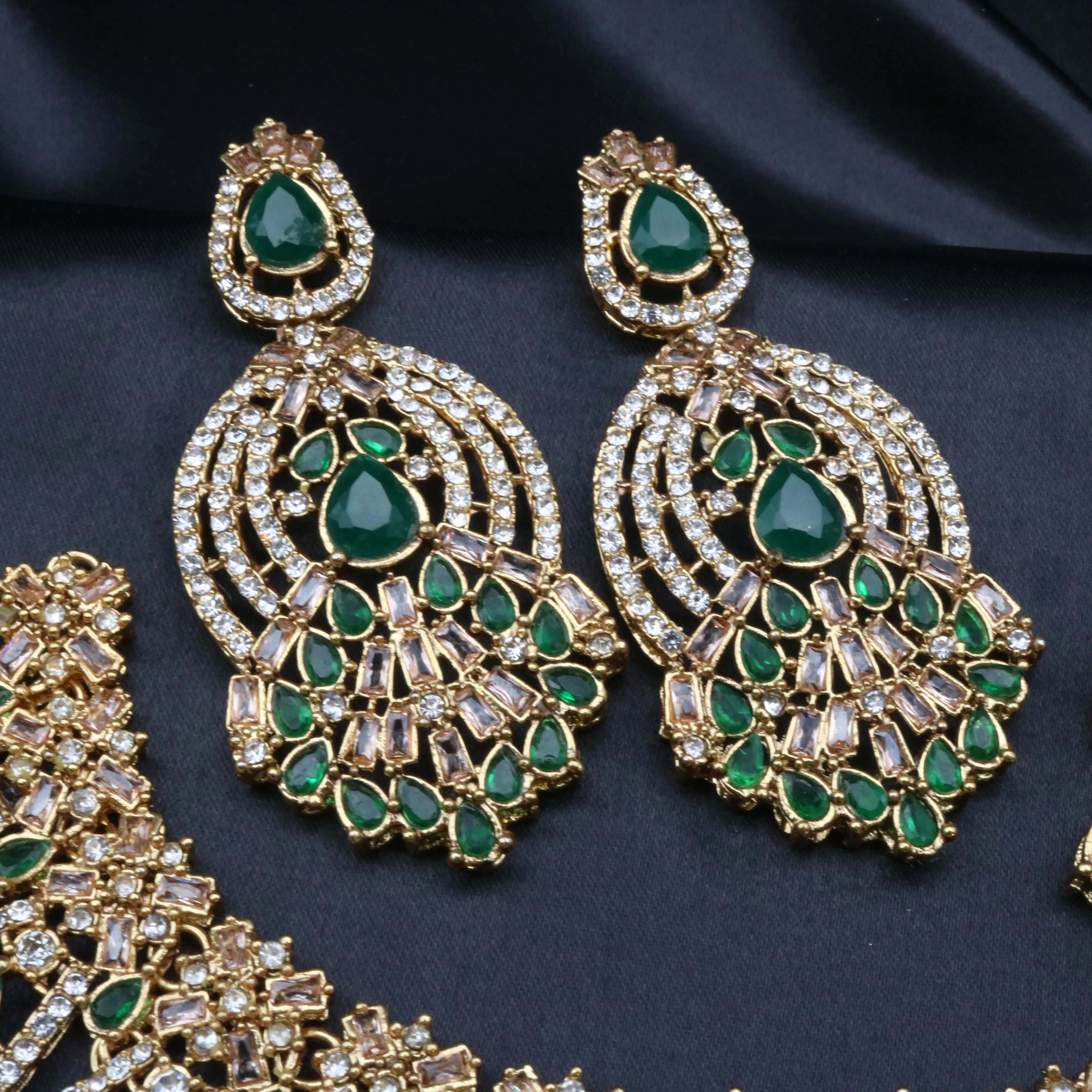 Calypso green gemstone chandelier earrings with American diamonds and tear-drop detailing