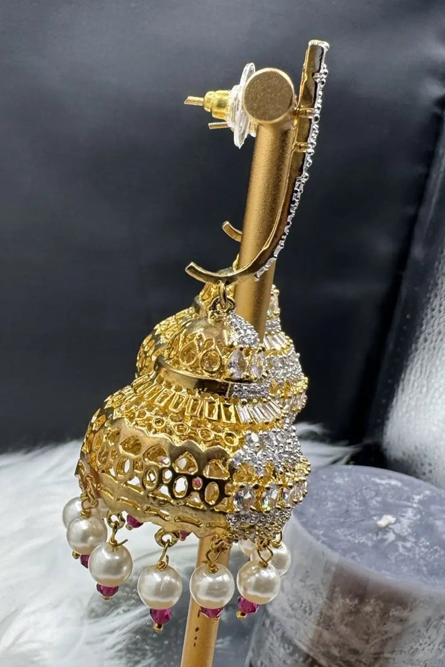 backside view of Pakistani design jhumkay with jarao craftsmanship. Clear gemstones with pearl accents providing an exquisite touch.