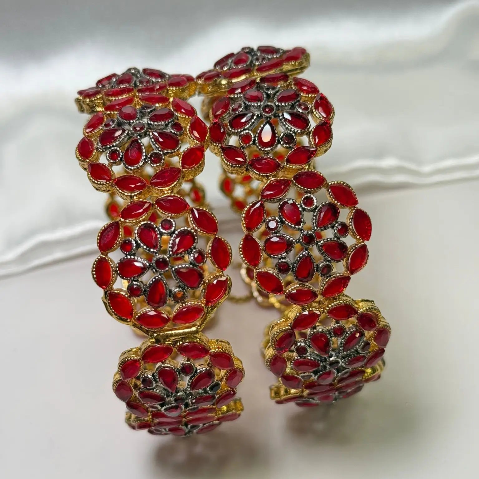 Red Celestial bangles with marquise stones and black accents – side view