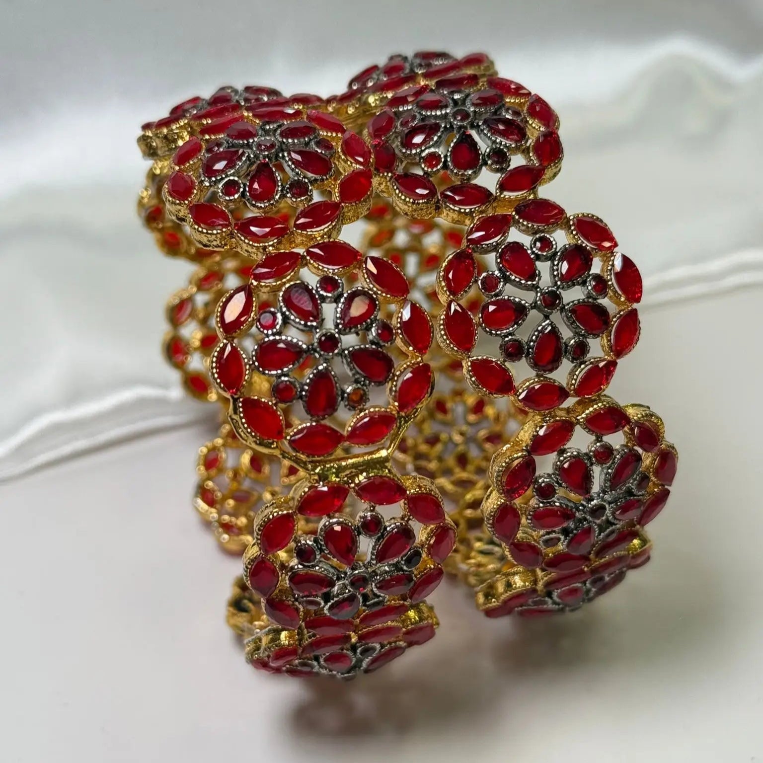 Openable gold-toned red bangles in floral pattern