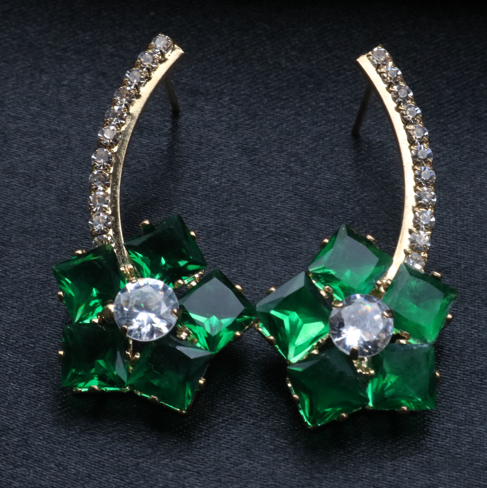 A pair of stainless steel and gold-plated earrings with green and clear American diamonds.