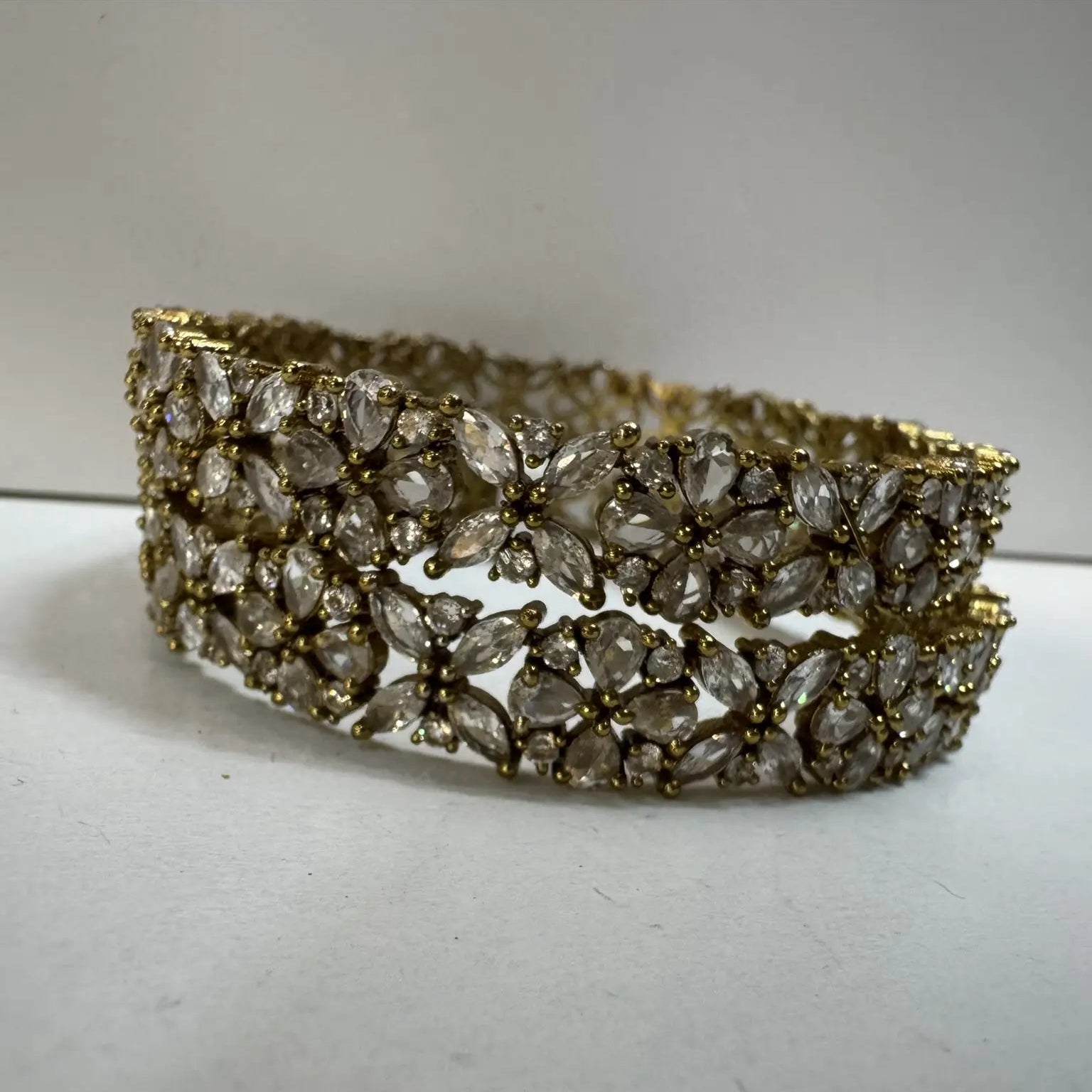 Gold floral bangle set with American diamonds for festive wear