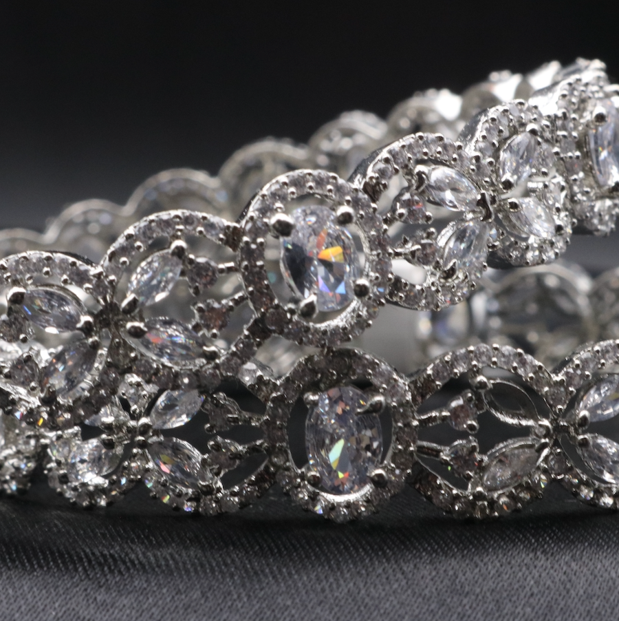 Closer view of American diamonds stainless steel bangles with clear gemstones  