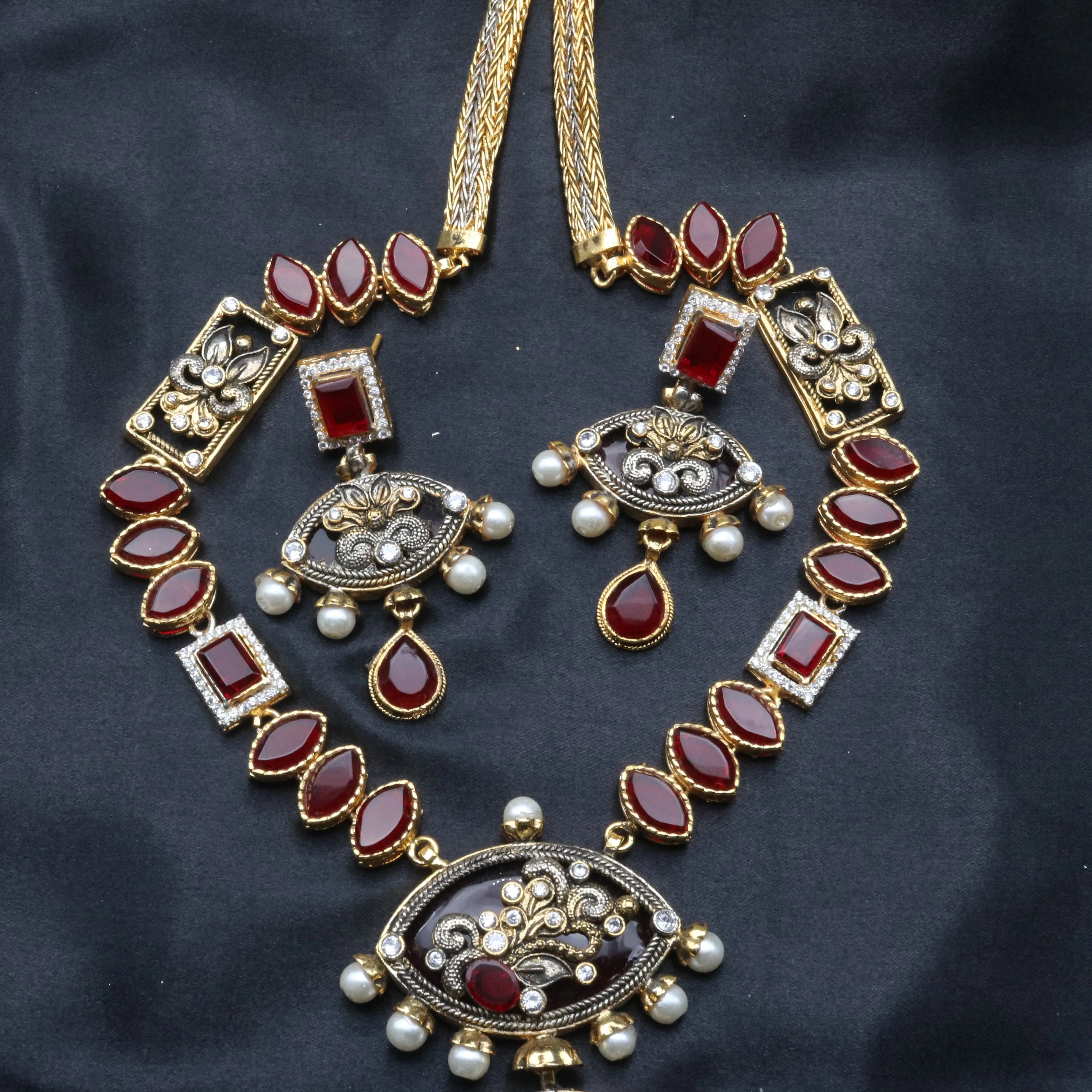 Top view of the full Egypt necklace set with rectangular motifs, ruby marquise stones, and vintage finish.