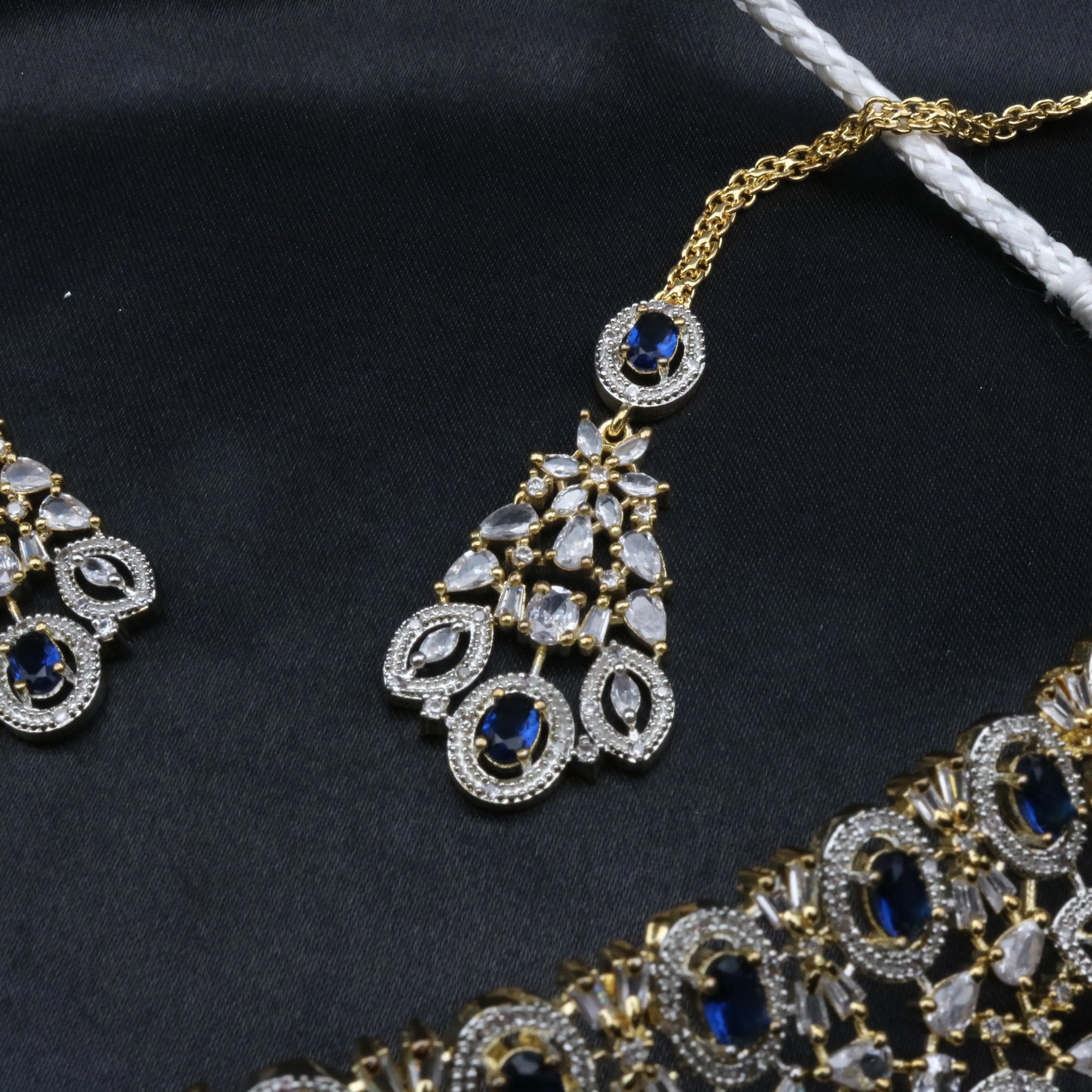 Fairy teeka in blue gemstone variant with CZ stones and gold chain.