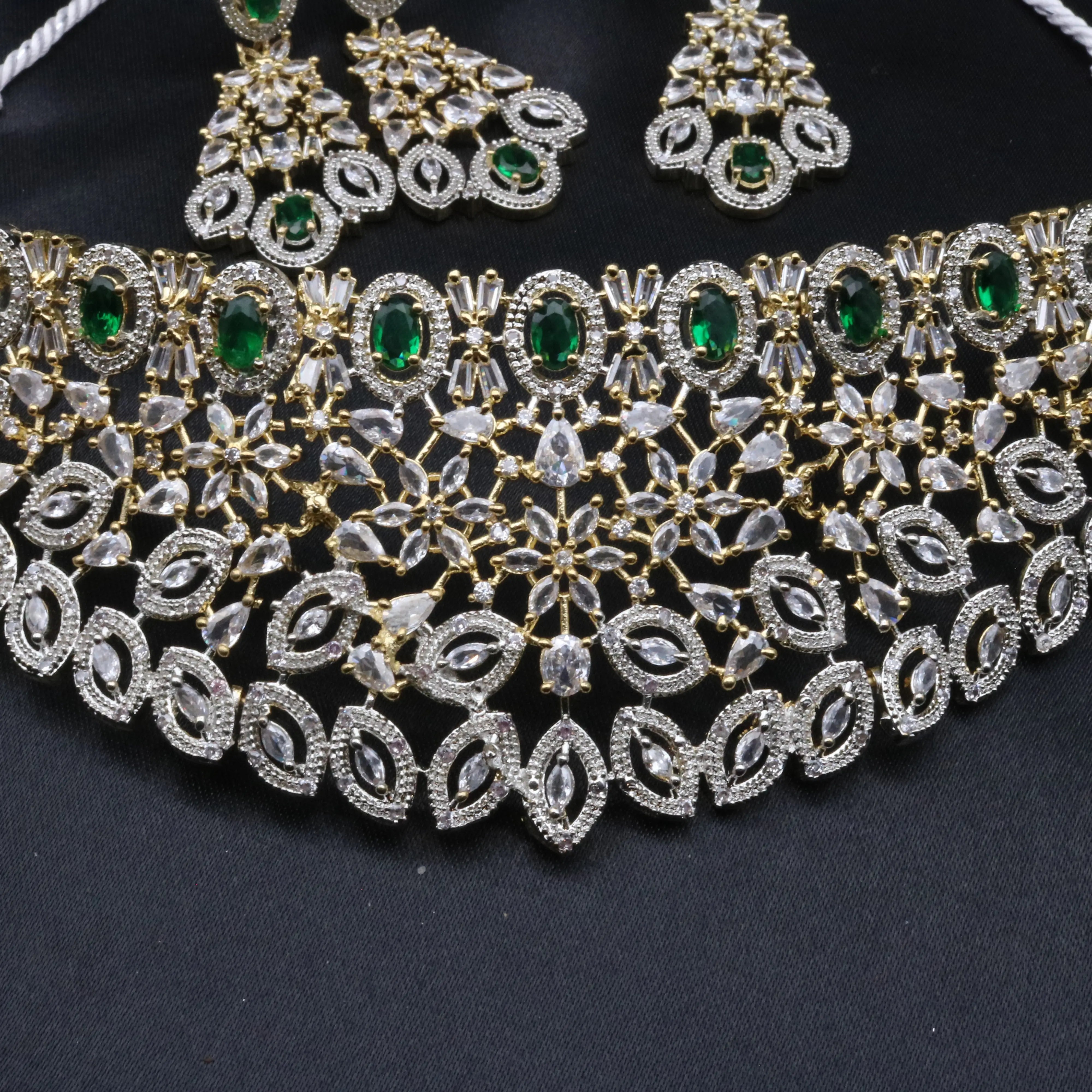 Close-up of Fairy necklace set with green oval stones and American diamond detailing on a dual-tone choker base.