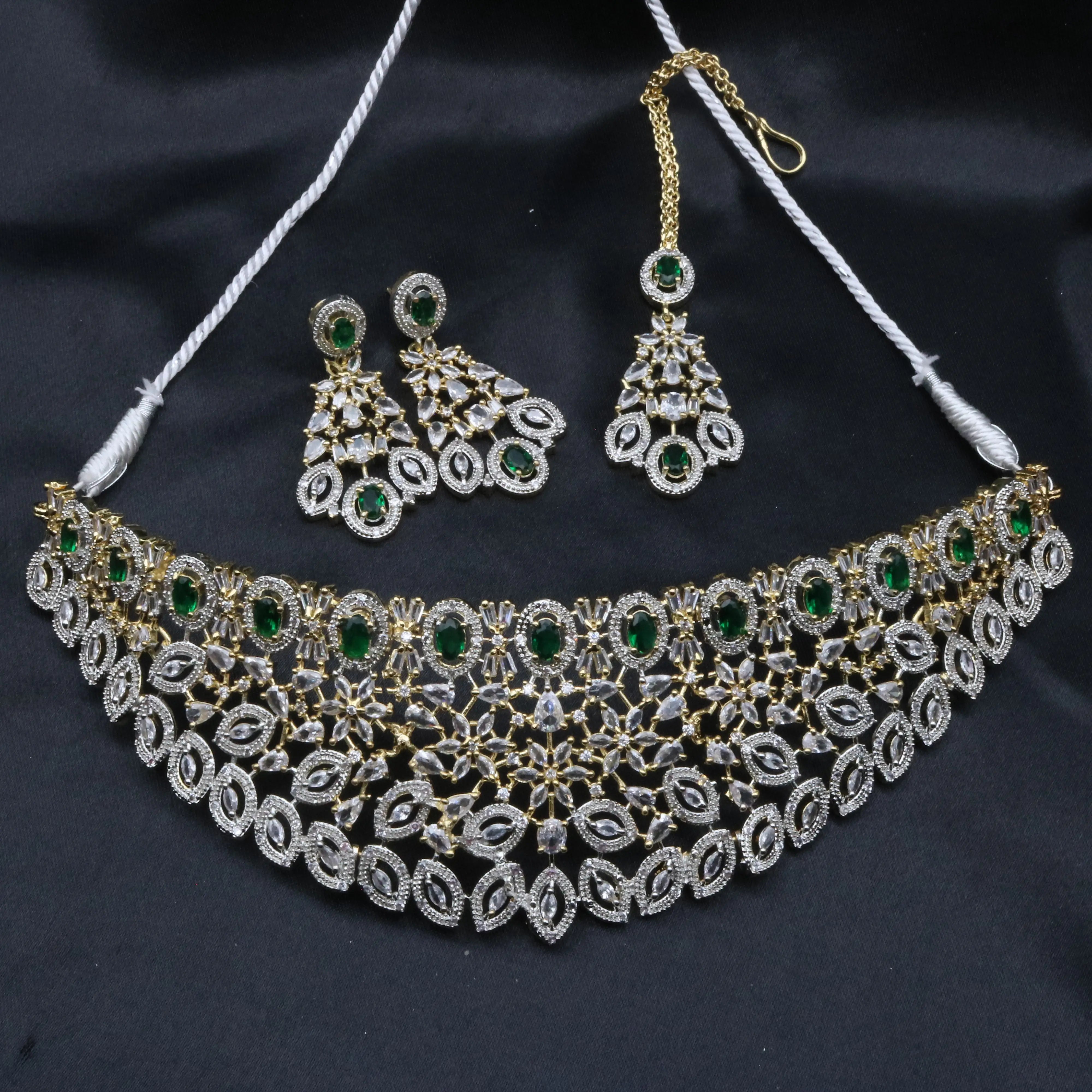 Full layout of the Fairy necklace set in green variant including earrings, teeka, and statement choker necklace.