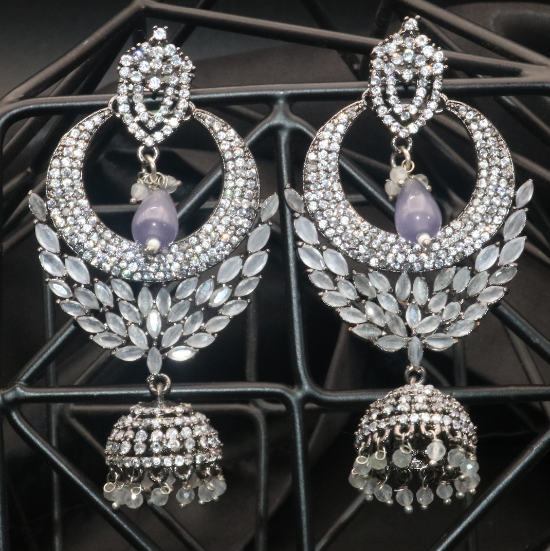 American Diamond and stainless steel, GRIFFIN boasts a stunning jhumka detail earring in grey gemstones