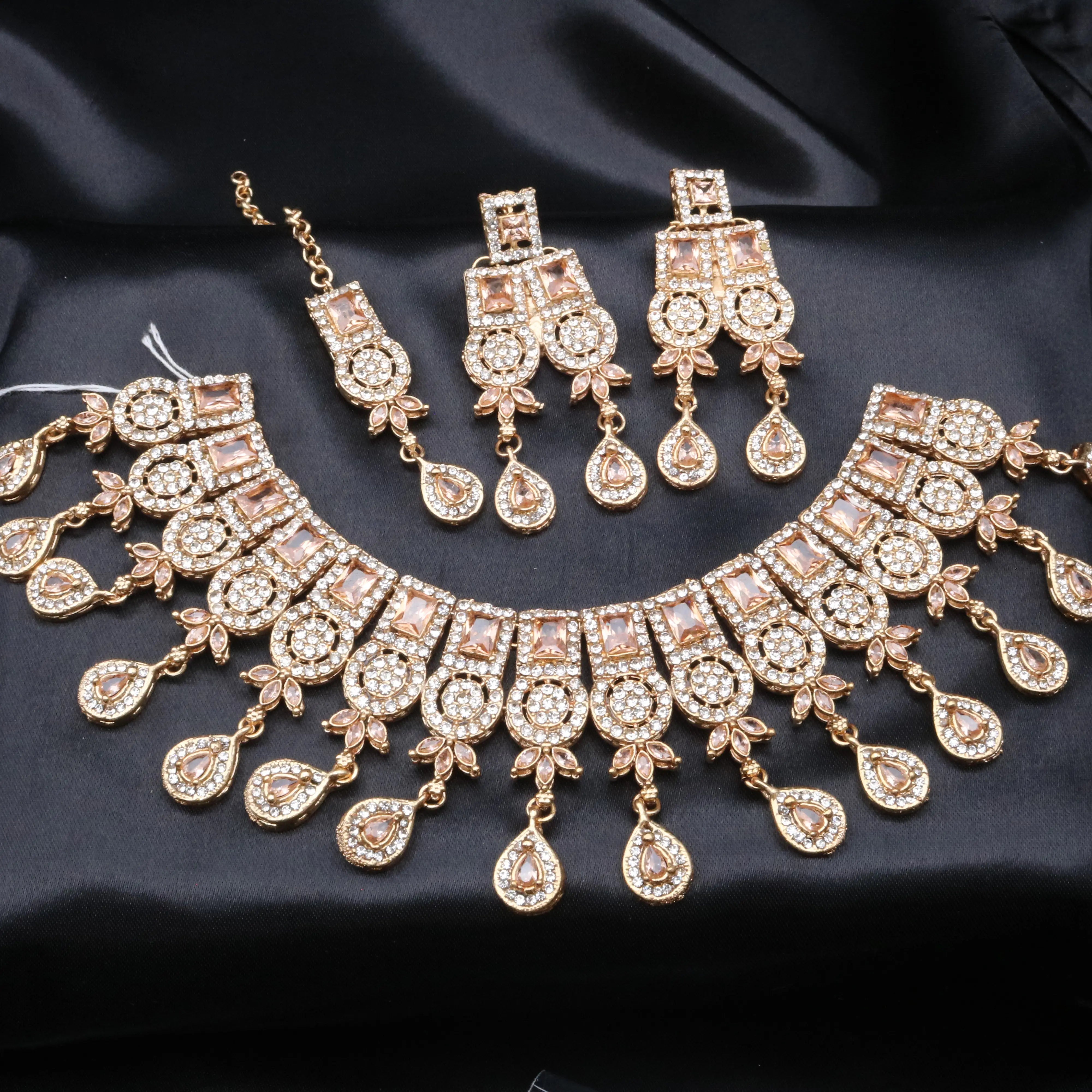 Champagne gold variant of Ishq set featuring warm-toned rectangular and teardrop stones.