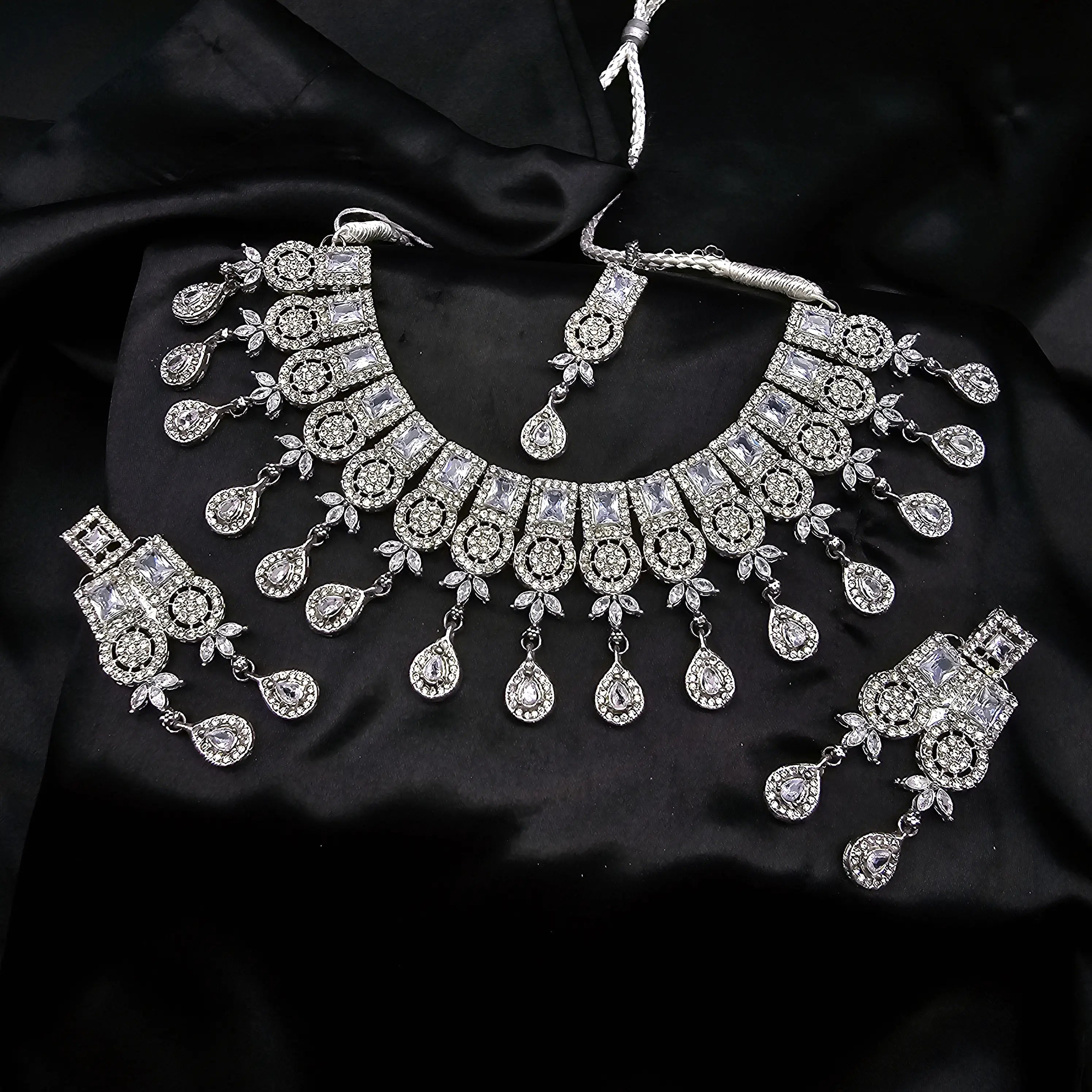 Another angle of Ishq silver variant showing choker layout and sparkling teardrop dangles.