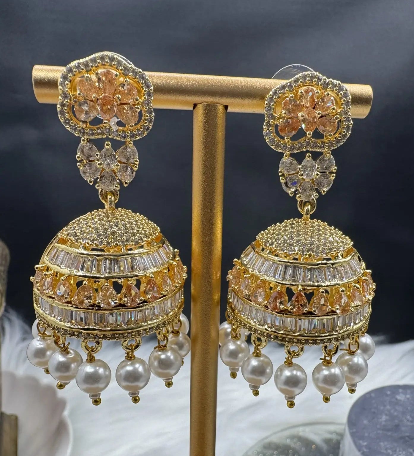 pair of Pakistani design intricate Jhumka with nano zarcon and jarao craftsmanship. They are gold plated and waterproof.