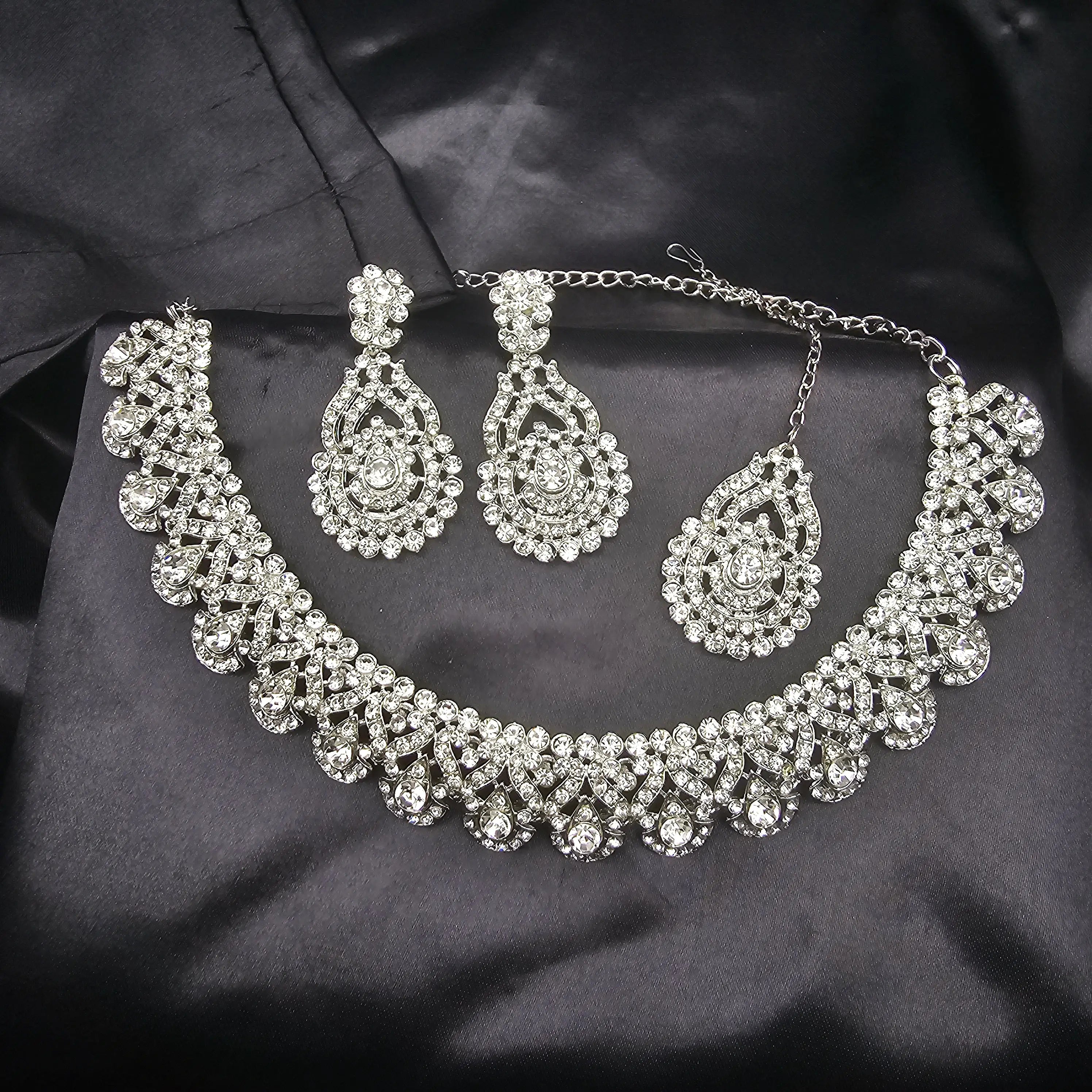 Lorea silver choker necklace set with teardrop CZ stones and matching long earrings and teeka on black satin