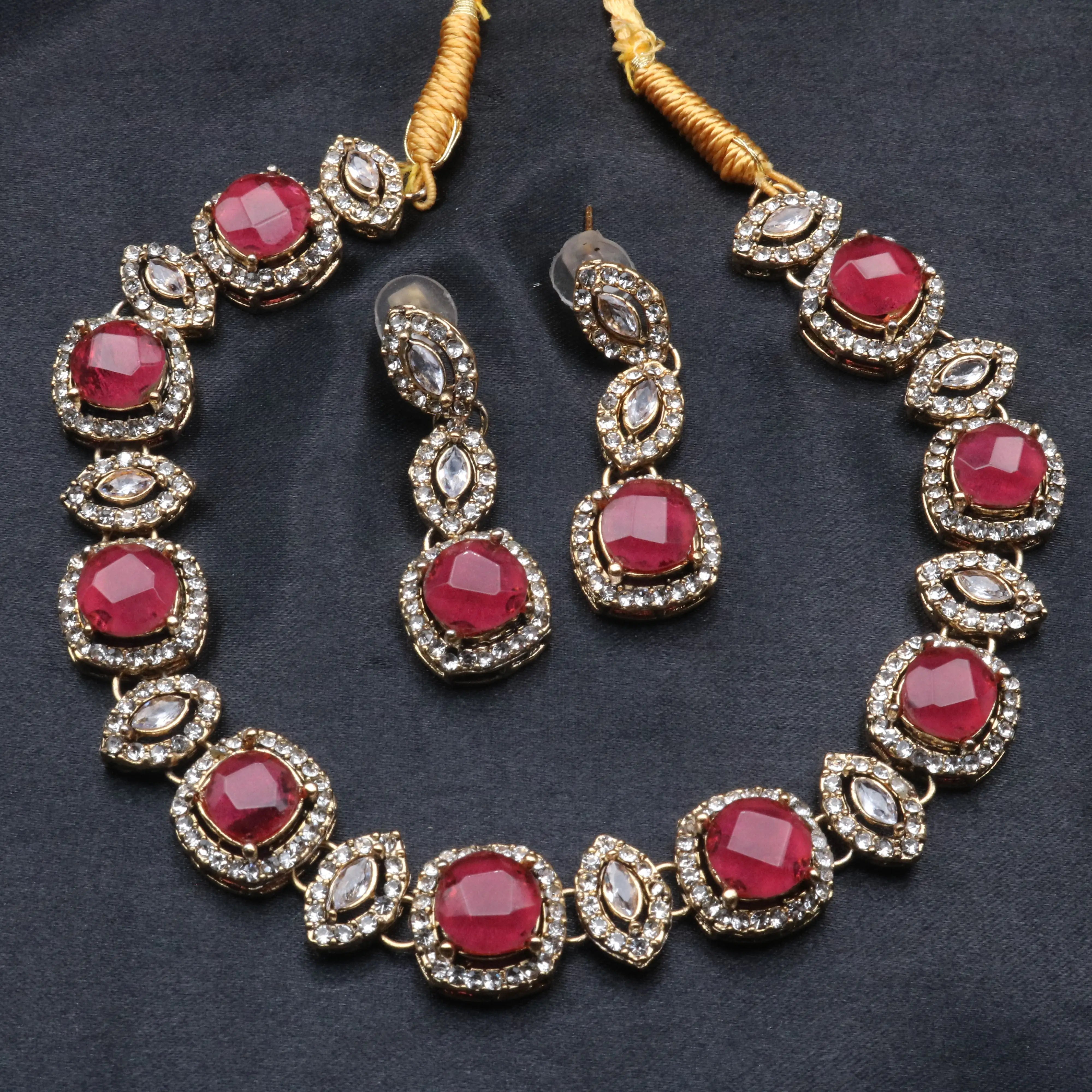 Ruby red Maharani necklace set featuring large CZ center stones with gold detailing