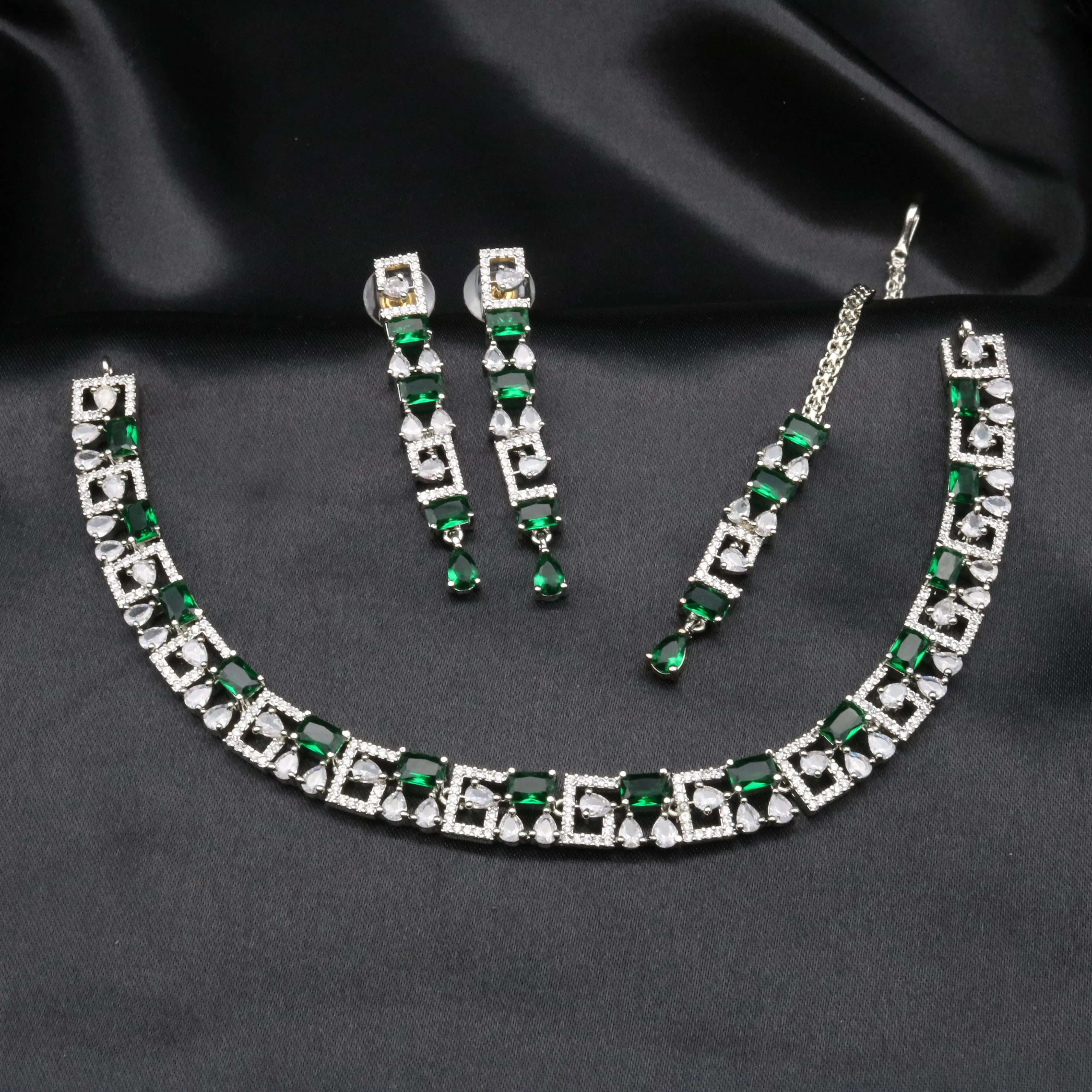 Full view of Majesty emerald green variant necklace set with matching earrings and chain.