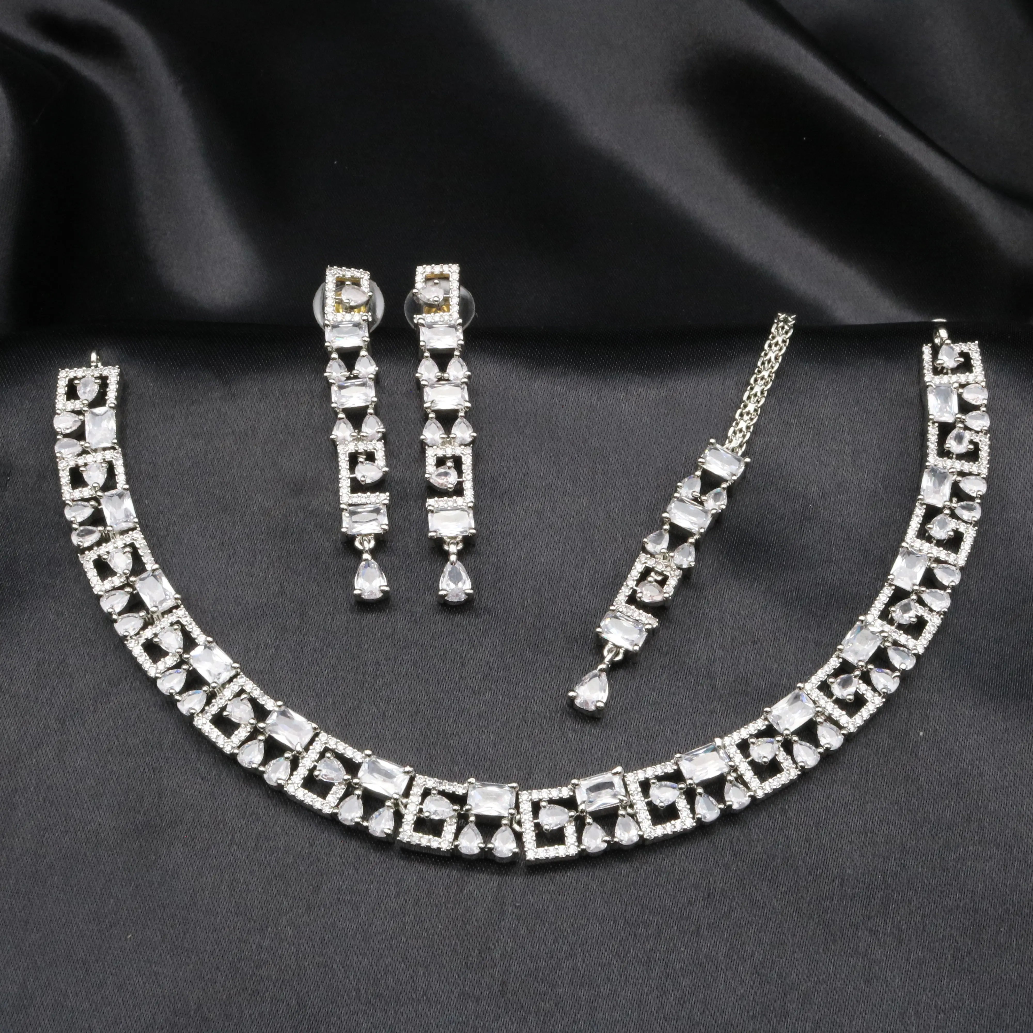 Majesty white CZ necklace set featuring square spiral design and pear-cut zircon drops.