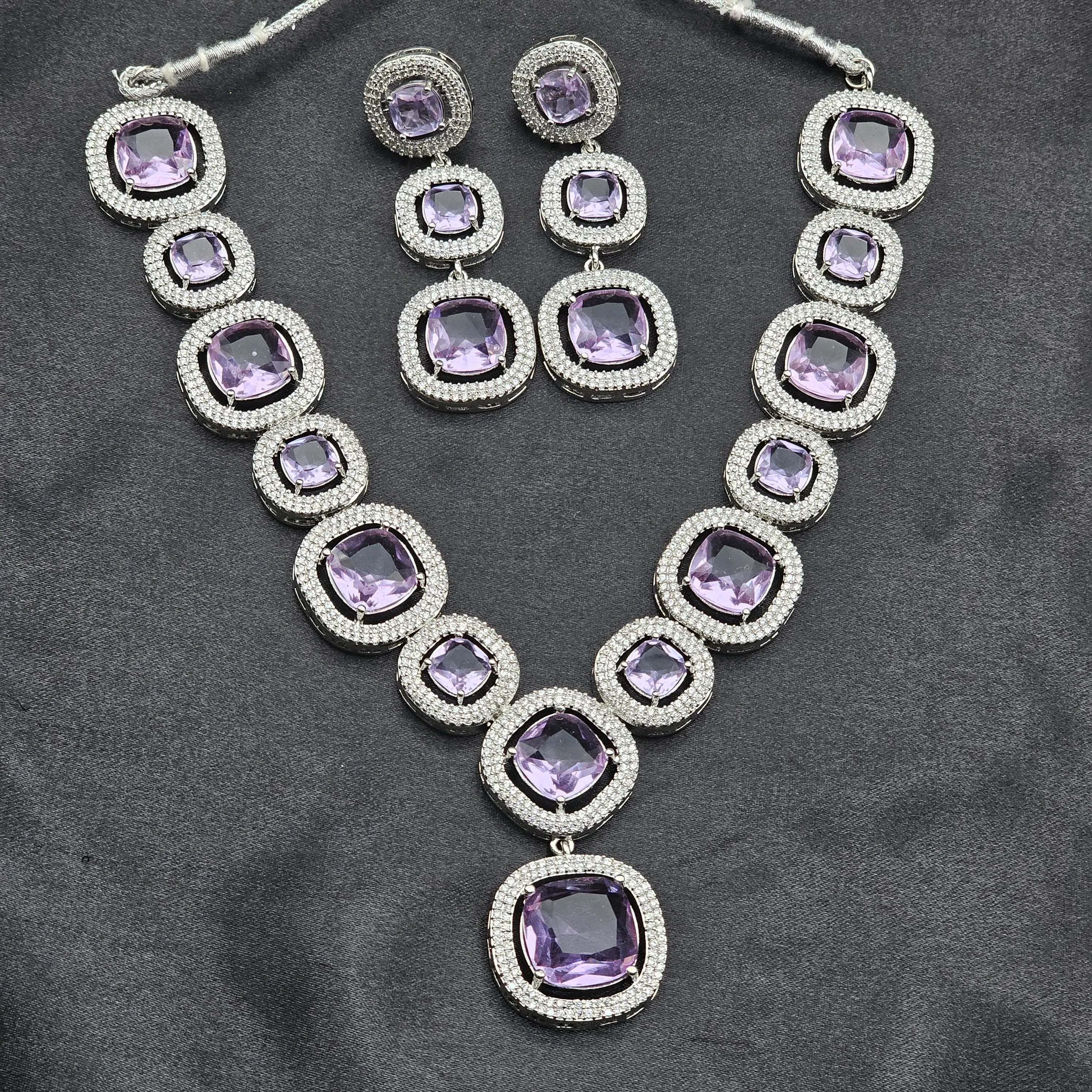 Pixie necklace set with cushion-cut purple stones and CZ halos on a silver base