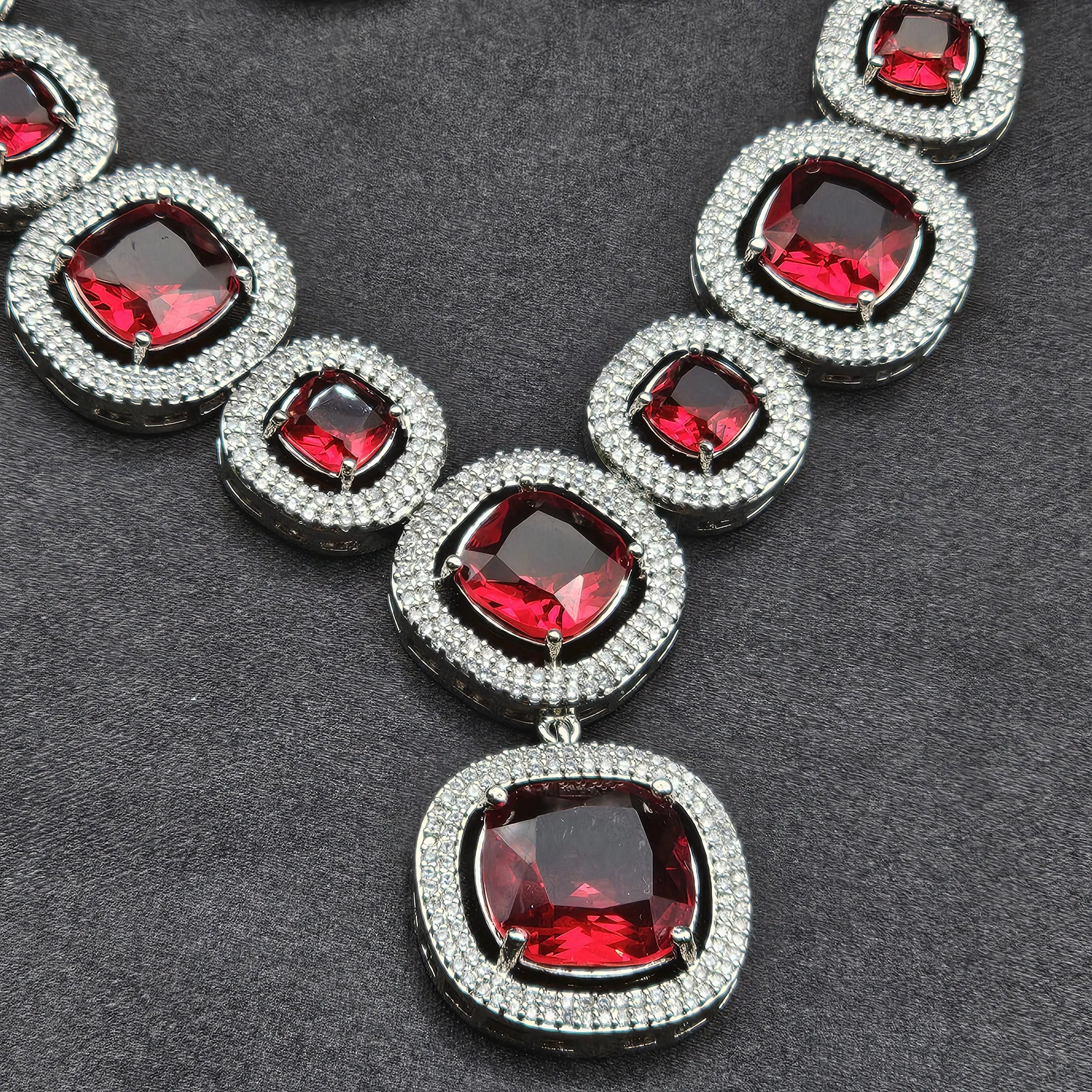 Red triple-drop cushion-cut earrings with pavé CZ detailing
