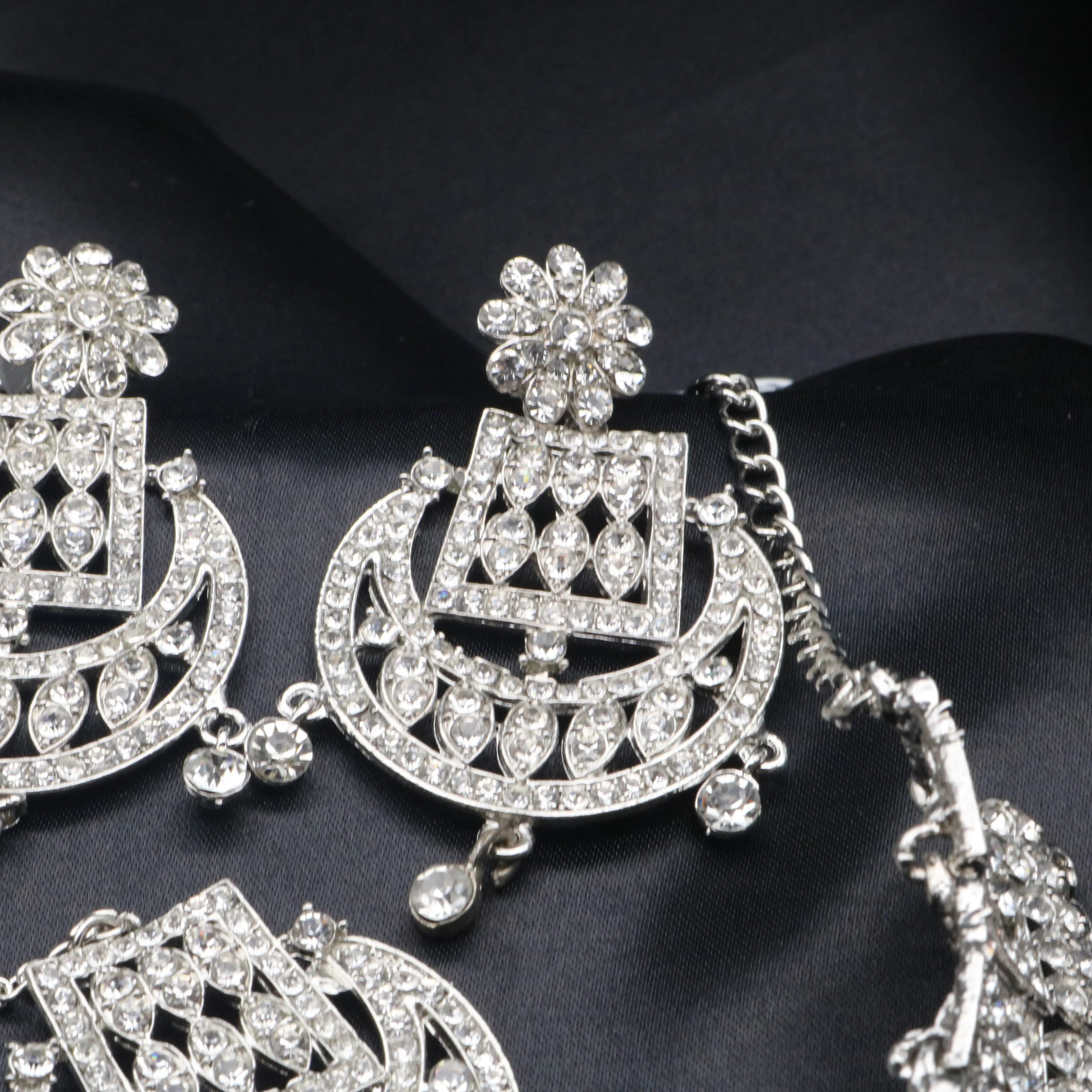 Floral-top earrings from the Queen Necklace Set with American diamond detailing