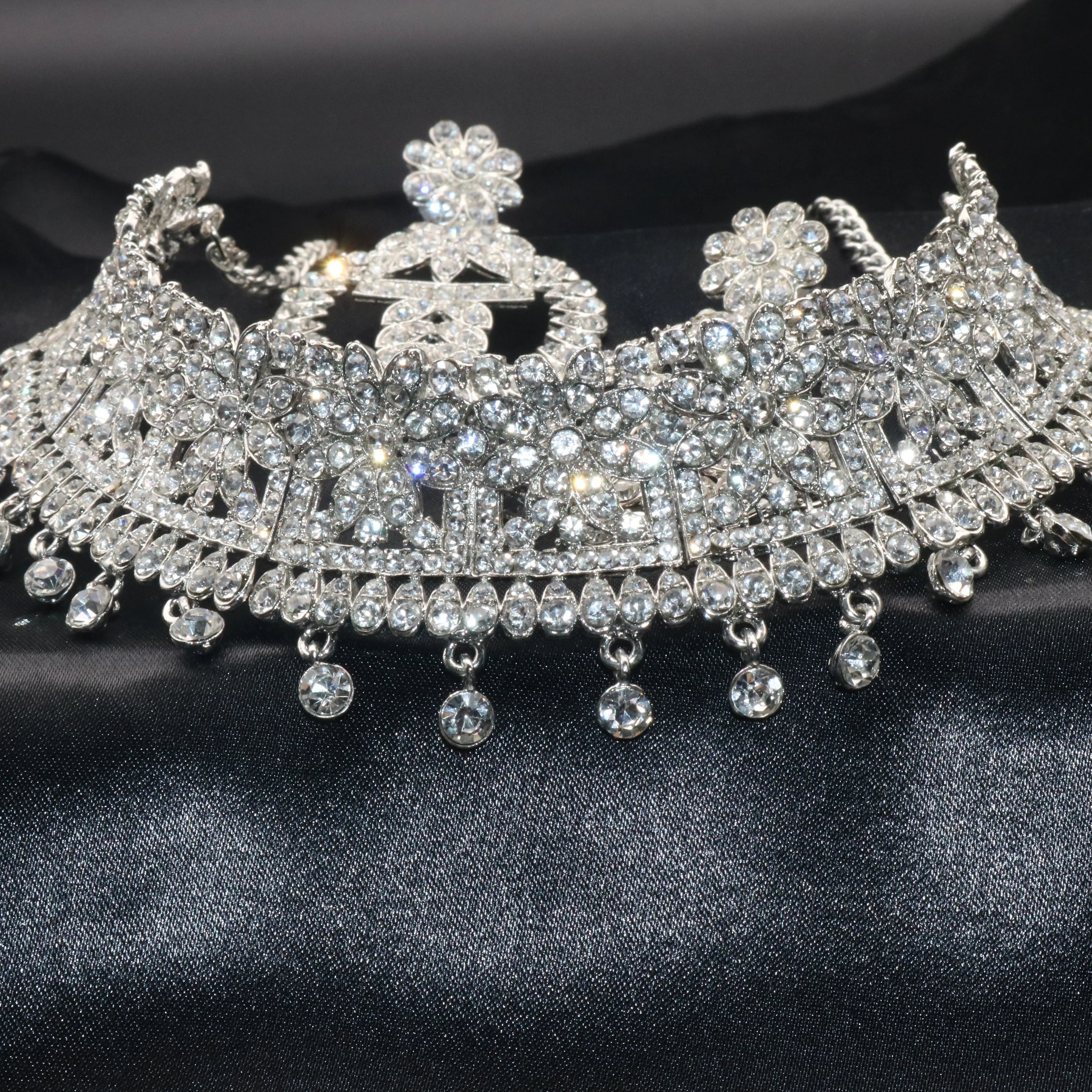 Side angle view of Sage necklace showcasing its sparkle and drop accents