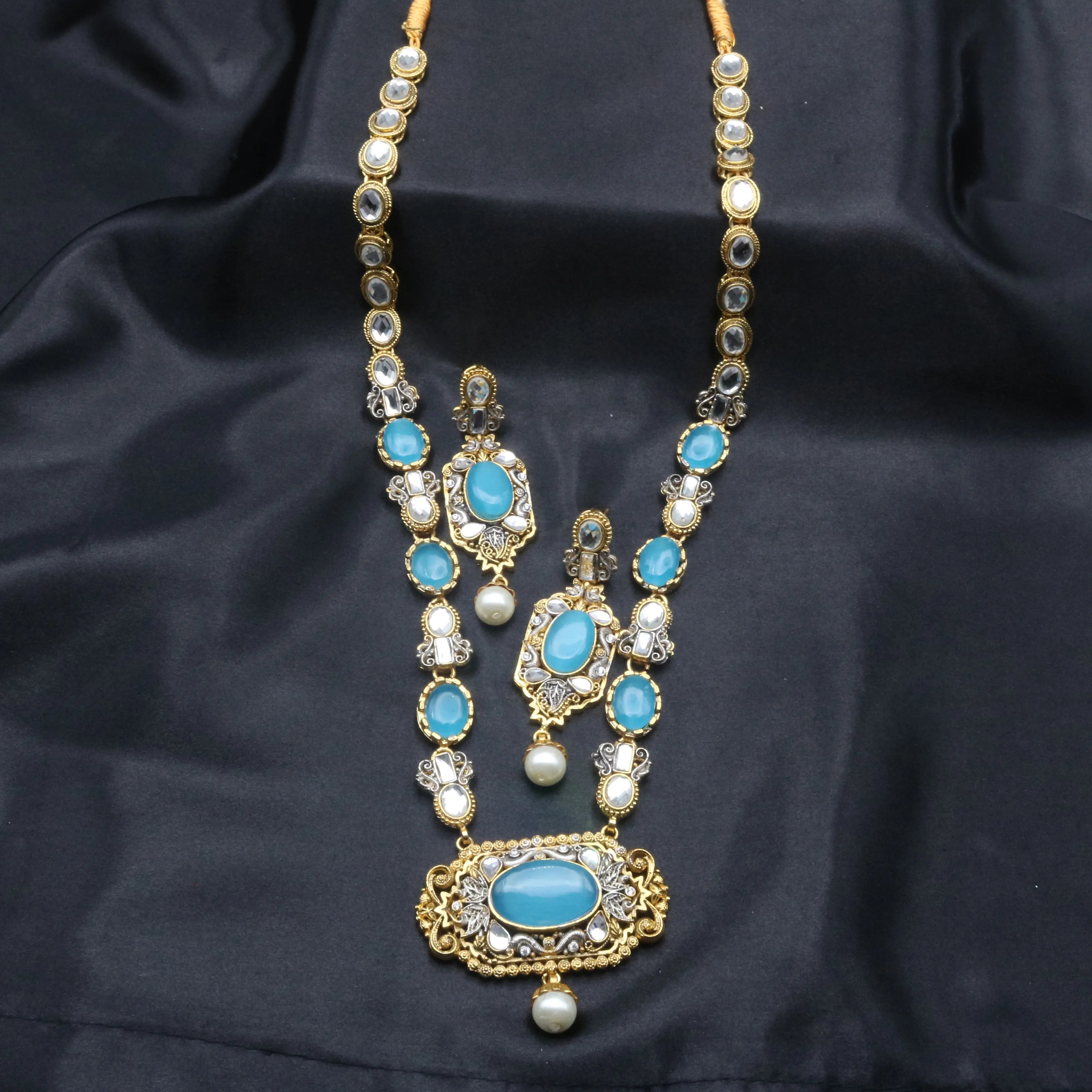 Front view of aqua gemstone necklace set with kundan elements and traditional pearl detailing