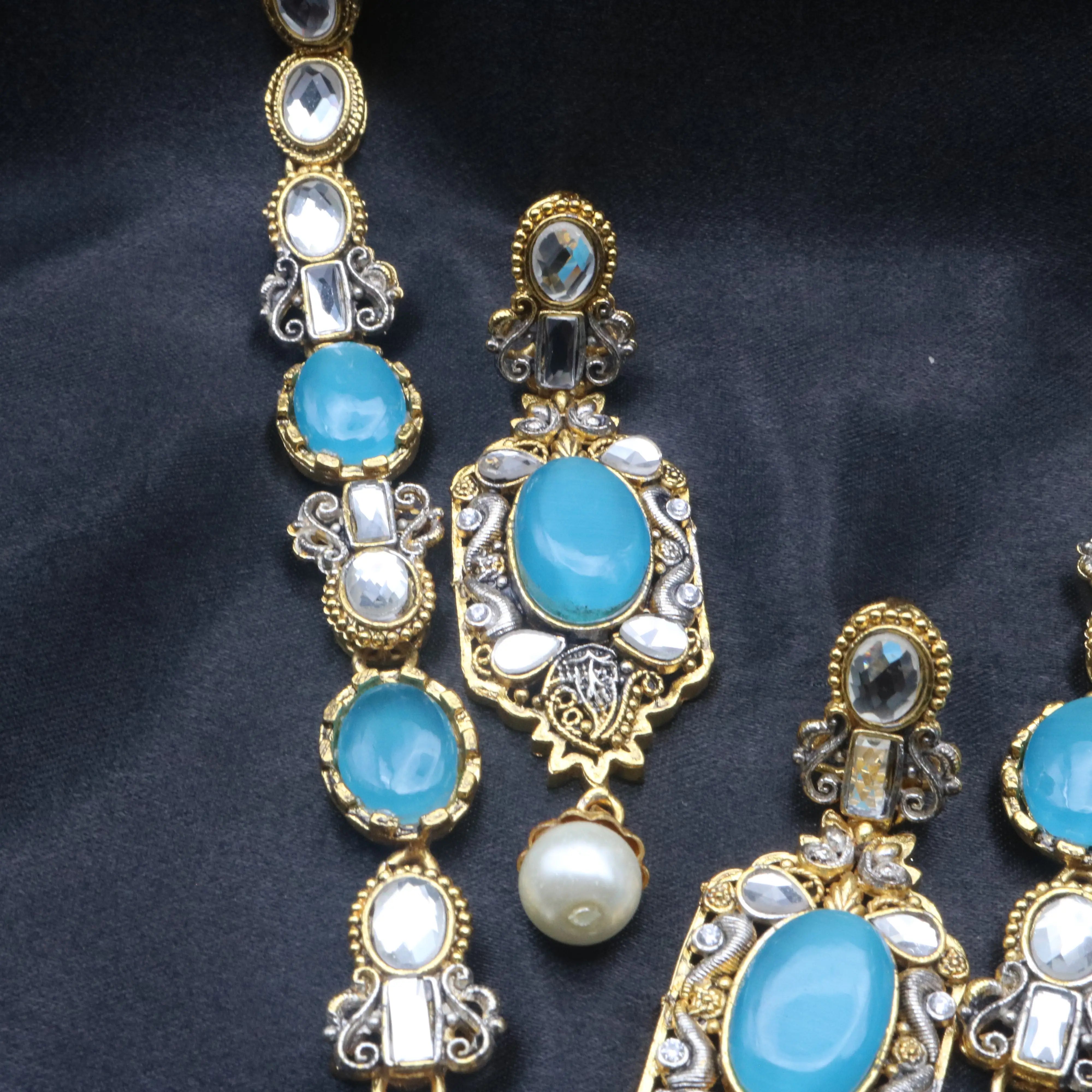 Zoomed-in view of upper necklace section and matching earring from Sea Foam set