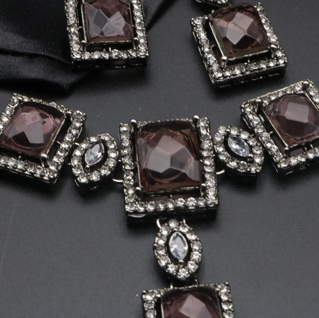 Detailed view of smoky variant with square CZ stones and black-rhodium finish