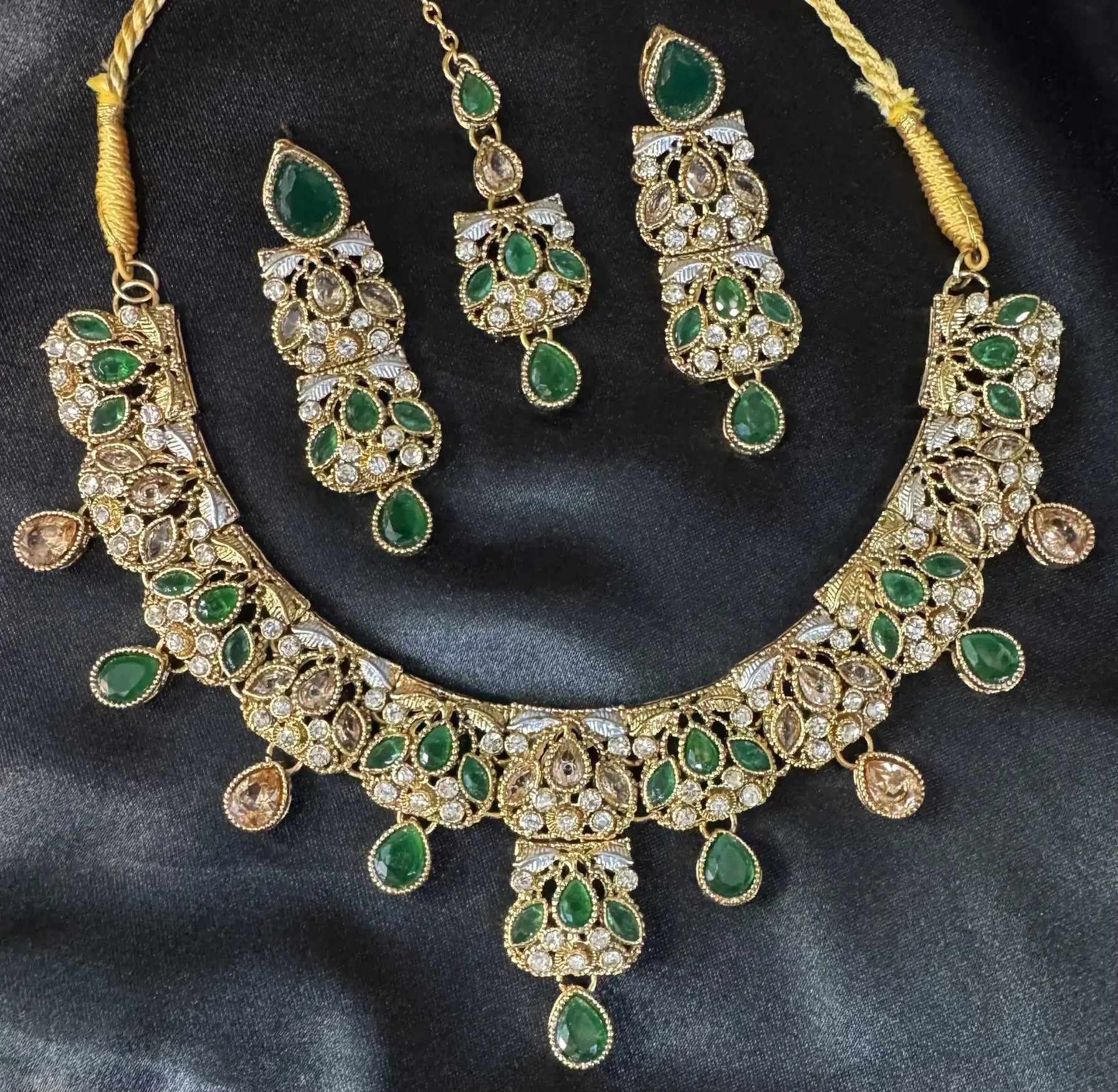 Zahra green gemstone bridal necklace set with gold base and American diamonds, includes teeka and earrings